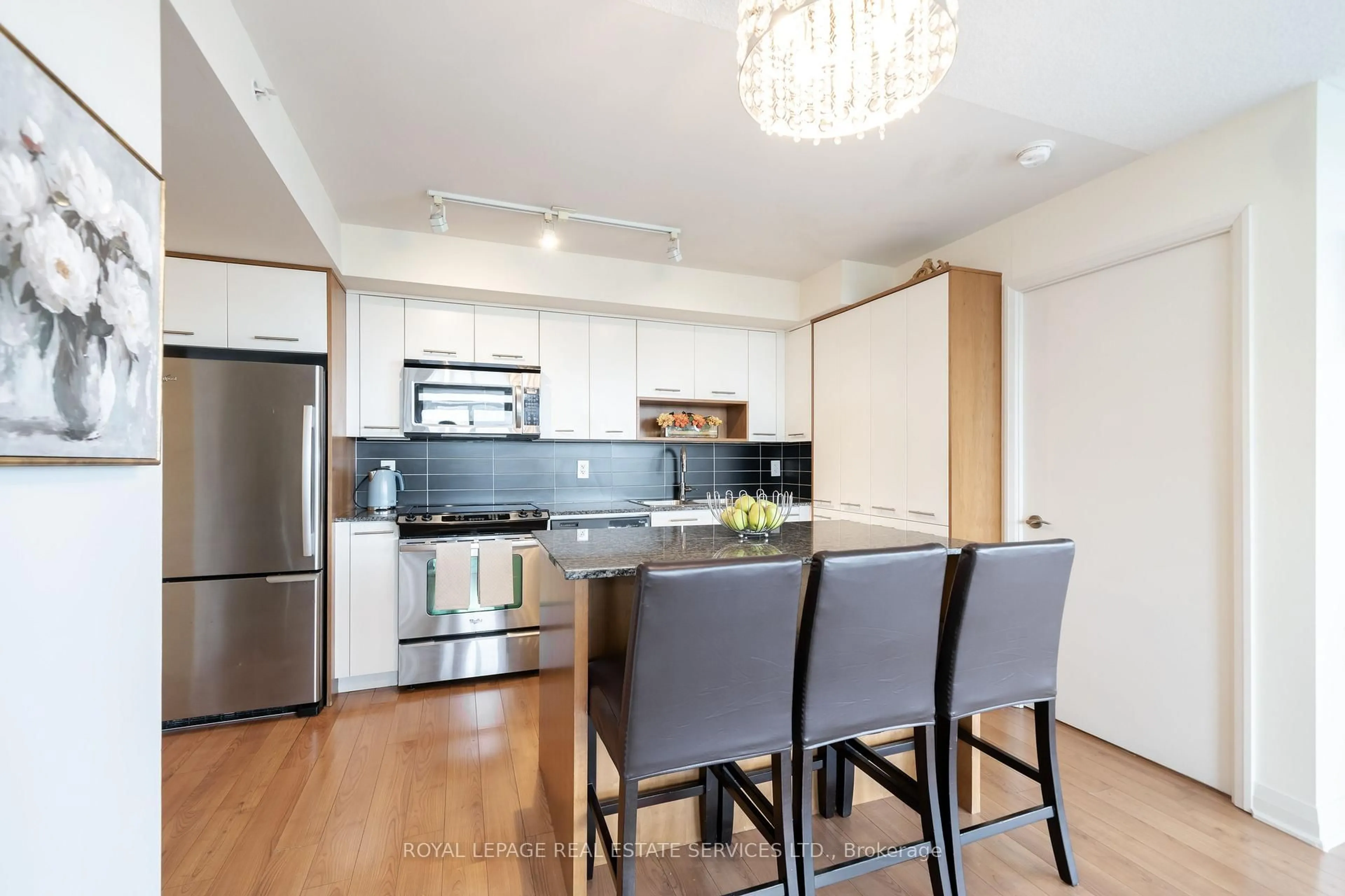 Open concept kitchen, wood/laminate floor for 1 Valhalla Inn Rd #607, Toronto Ontario M9B 1S9