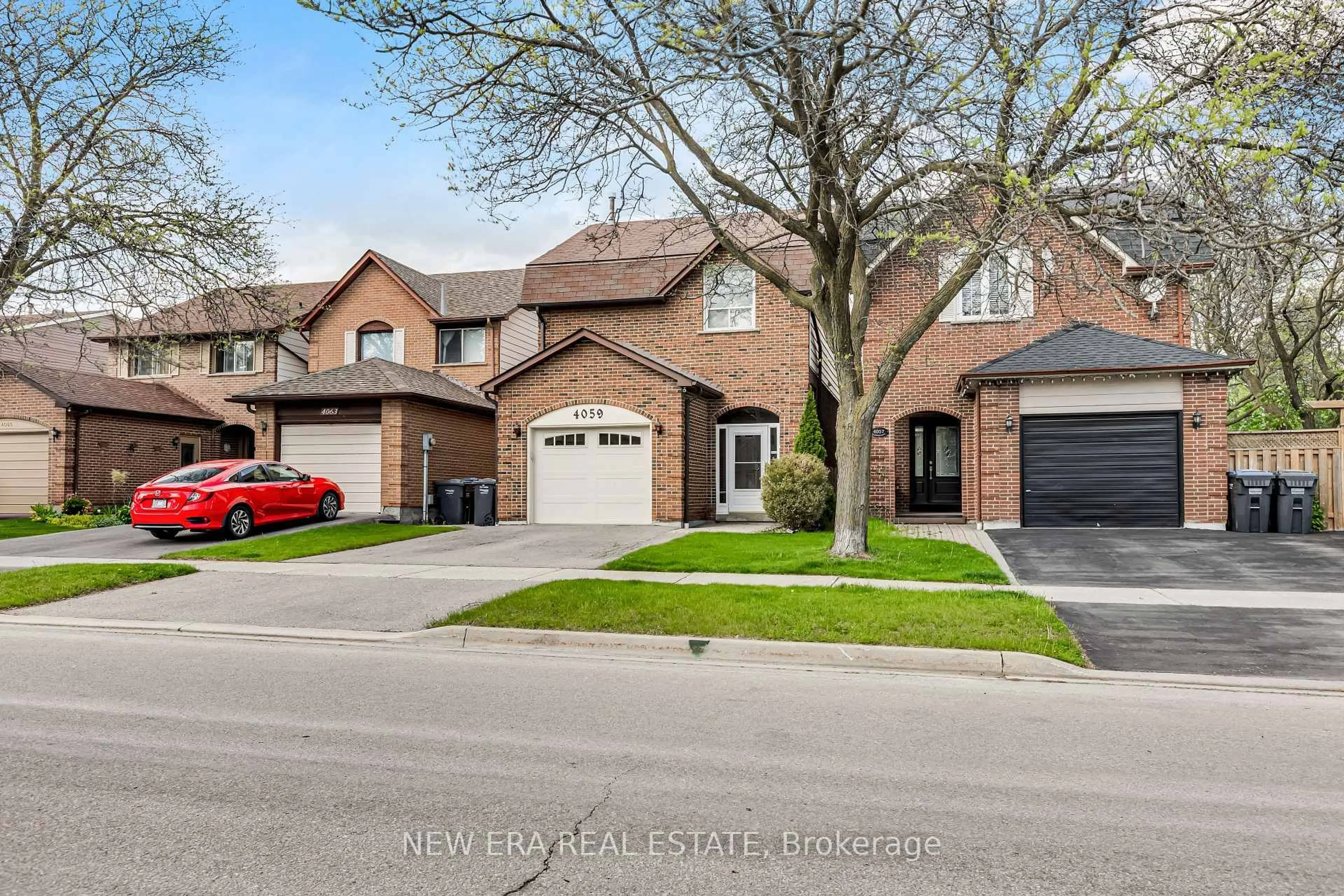 Home with brick exterior material, street for 4059 Teakwood Dr, Mississauga Ontario L5C 3L3