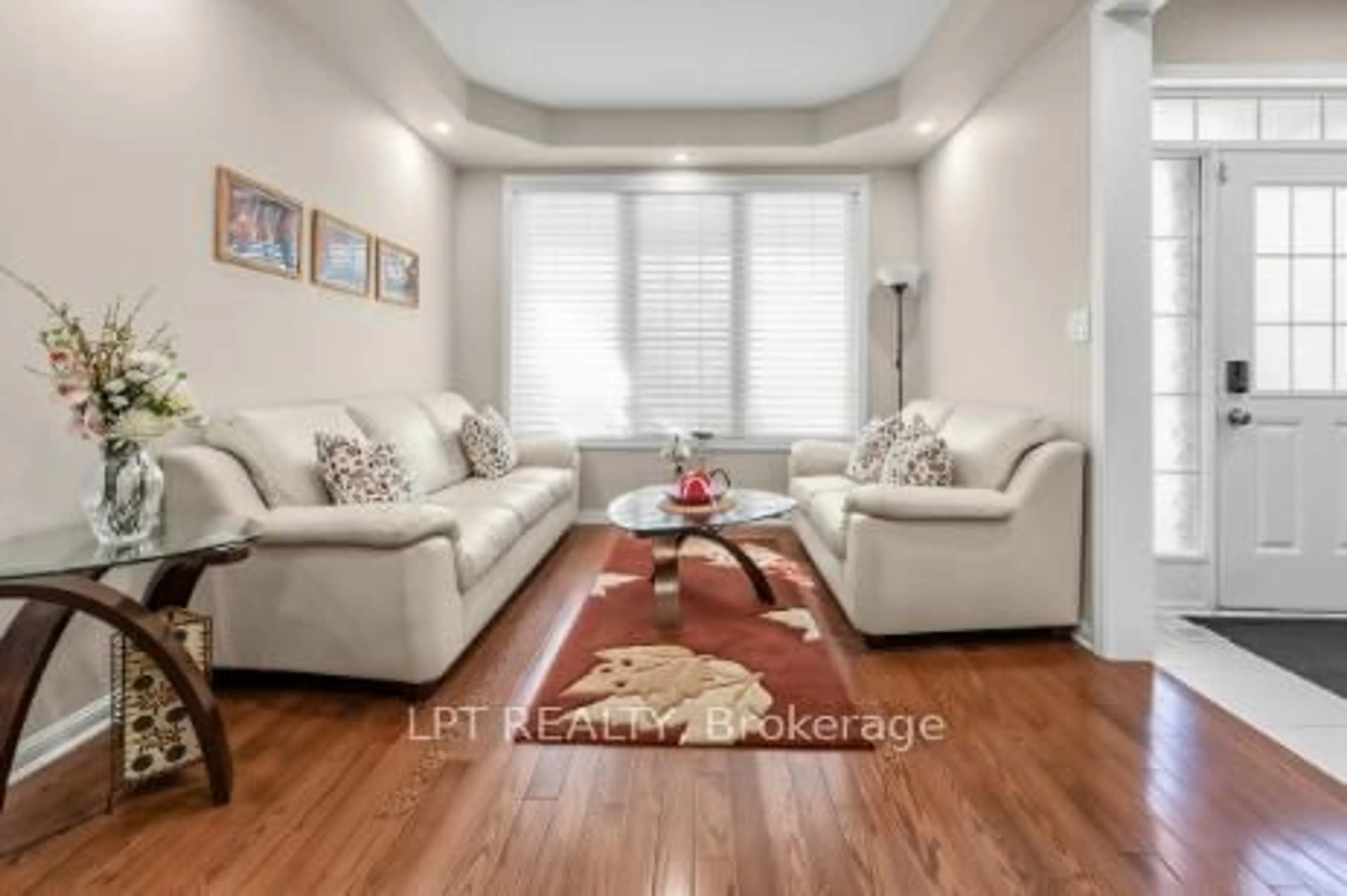 Living room with furniture, wood/laminate floor for 170 Fennamore Terr, Milton Ontario L9T 0Y3