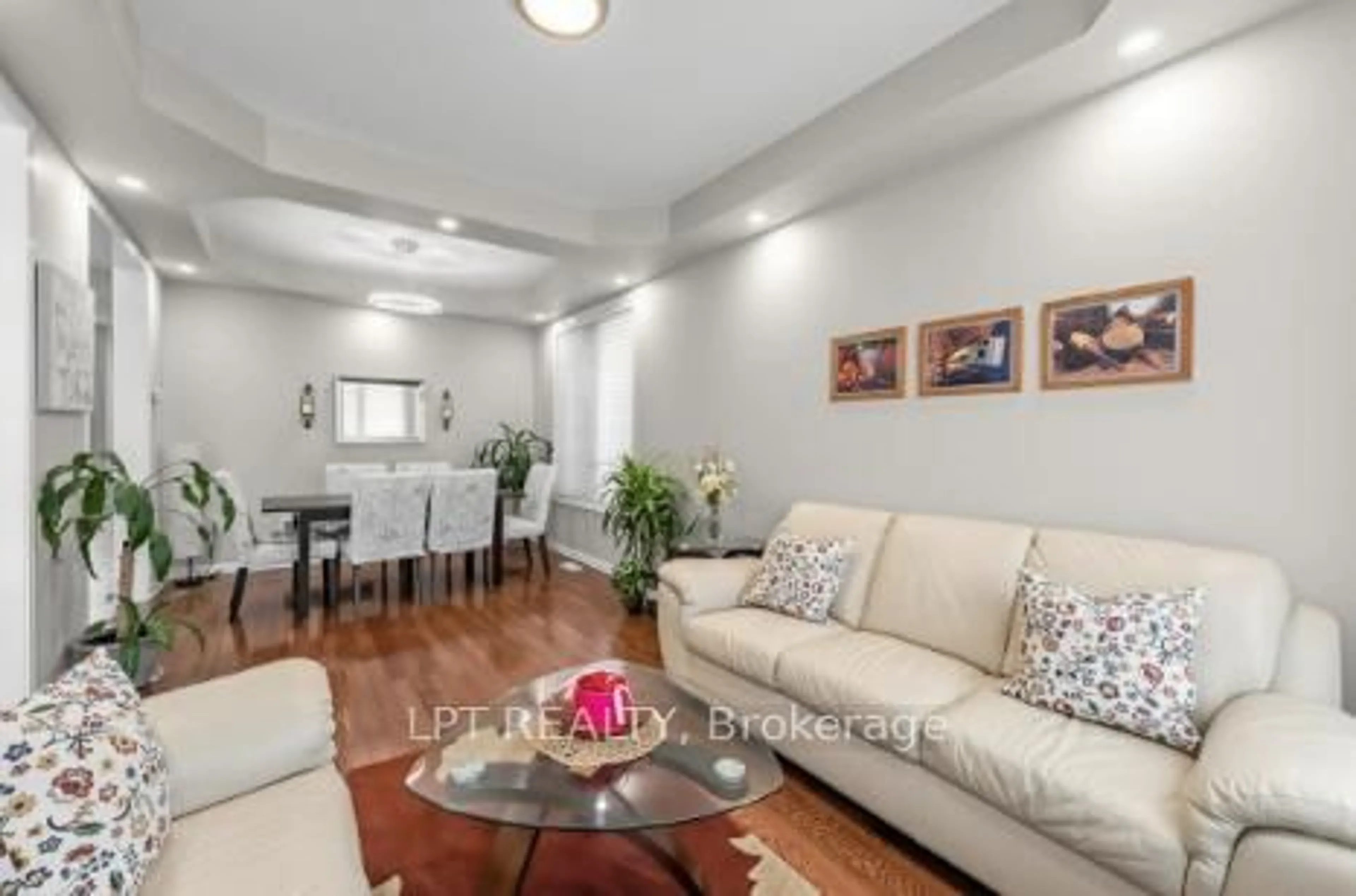 Living room with furniture, wood/laminate floor for 170 Fennamore Terr, Milton Ontario L9T 0Y3