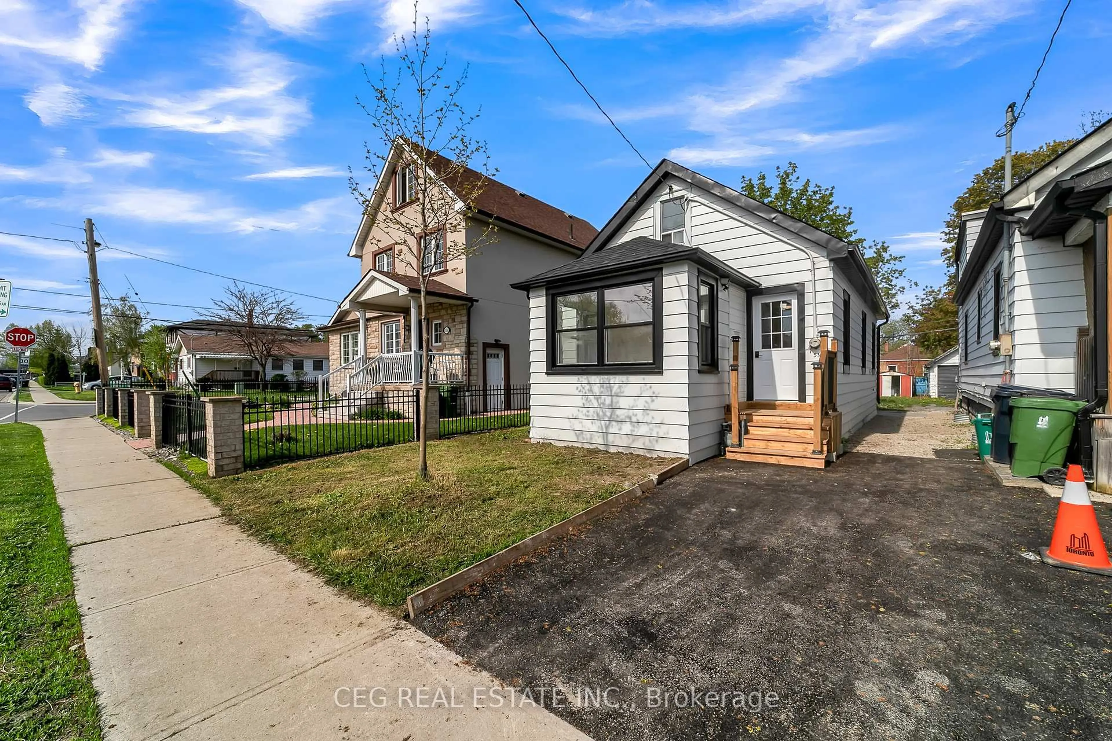 A pic from outside/outdoor area/front of a property/back of a property/a pic from drone, street for 53 Twenty Fourth St, Toronto Ontario M8V 3N3