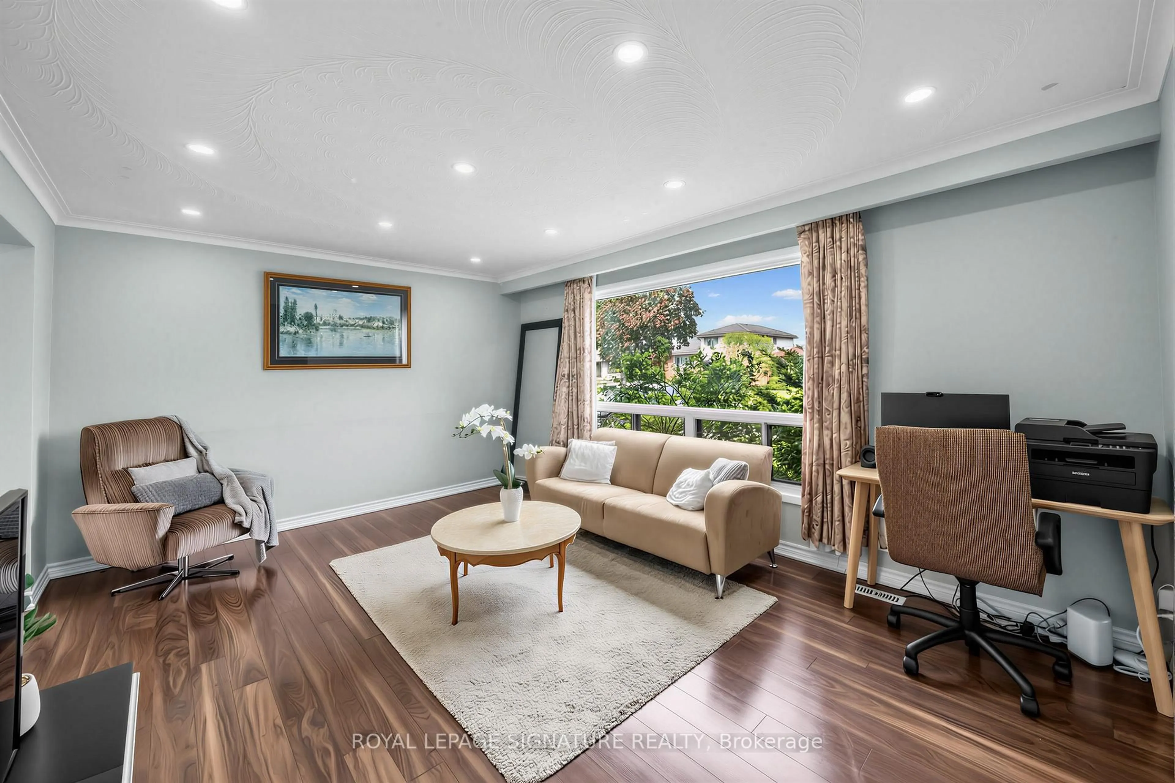 Living room with furniture, wood/laminate floor for 7258 Vernor Dr, Mississauga Ontario L4T 2P4
