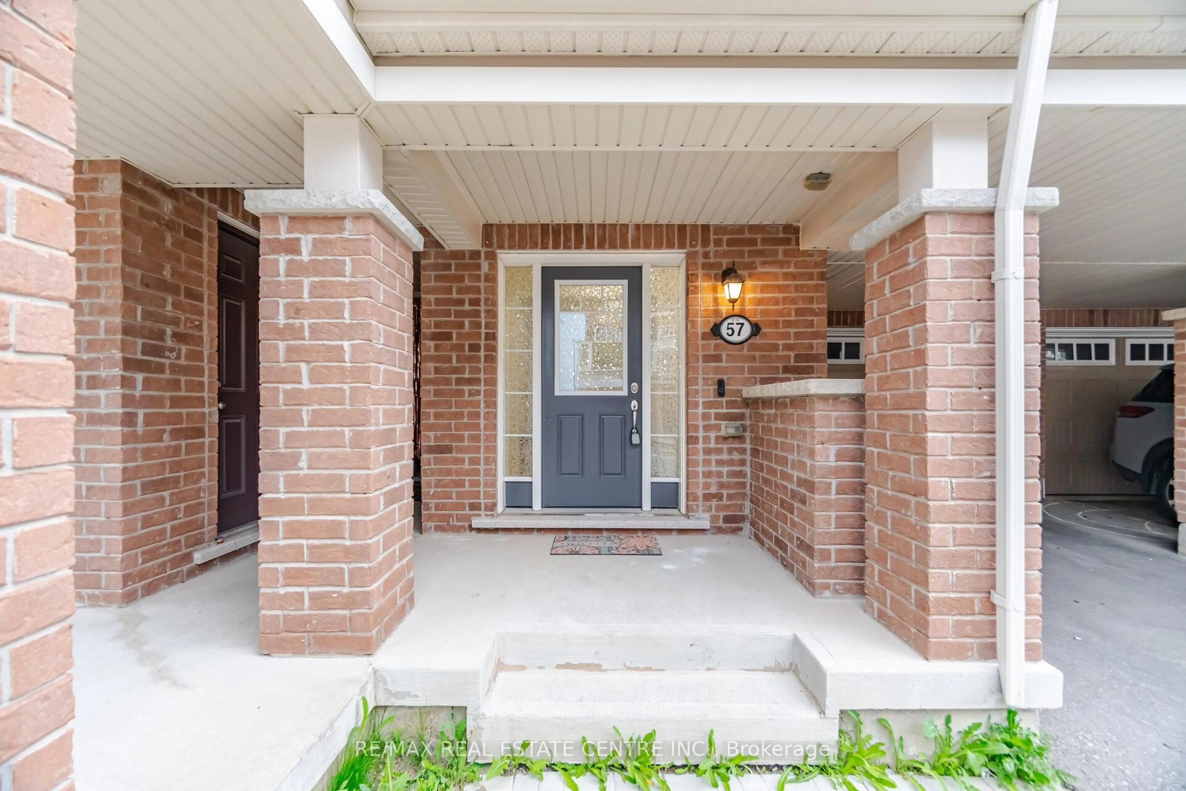 Home with brick exterior material, street for 1000 Asleton Blvd #57, Milton Ontario L5M 7P7