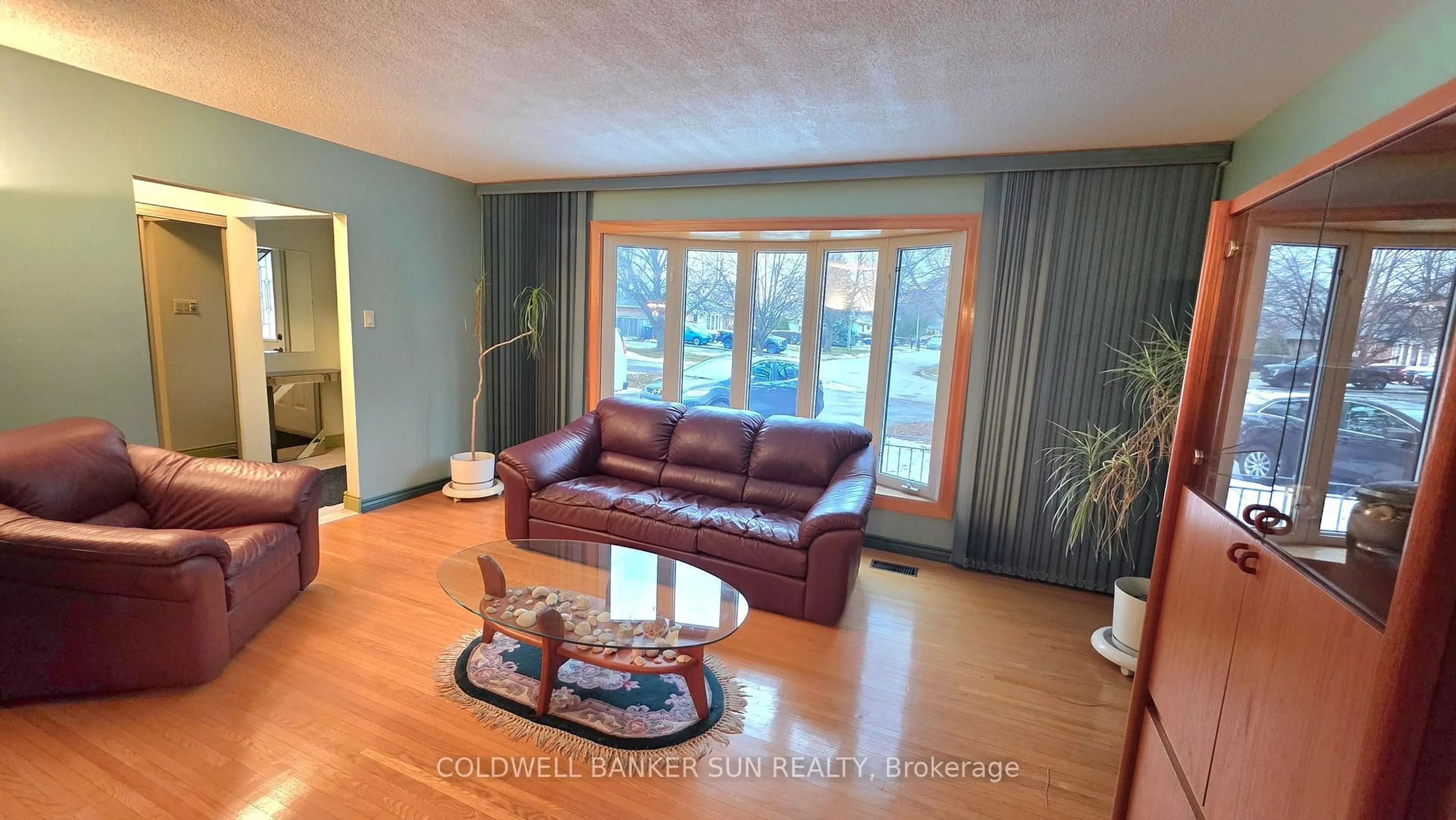 Living room with furniture, wood/laminate floor for 23 Brookdale Cres, Brampton Ontario L6T 1M8