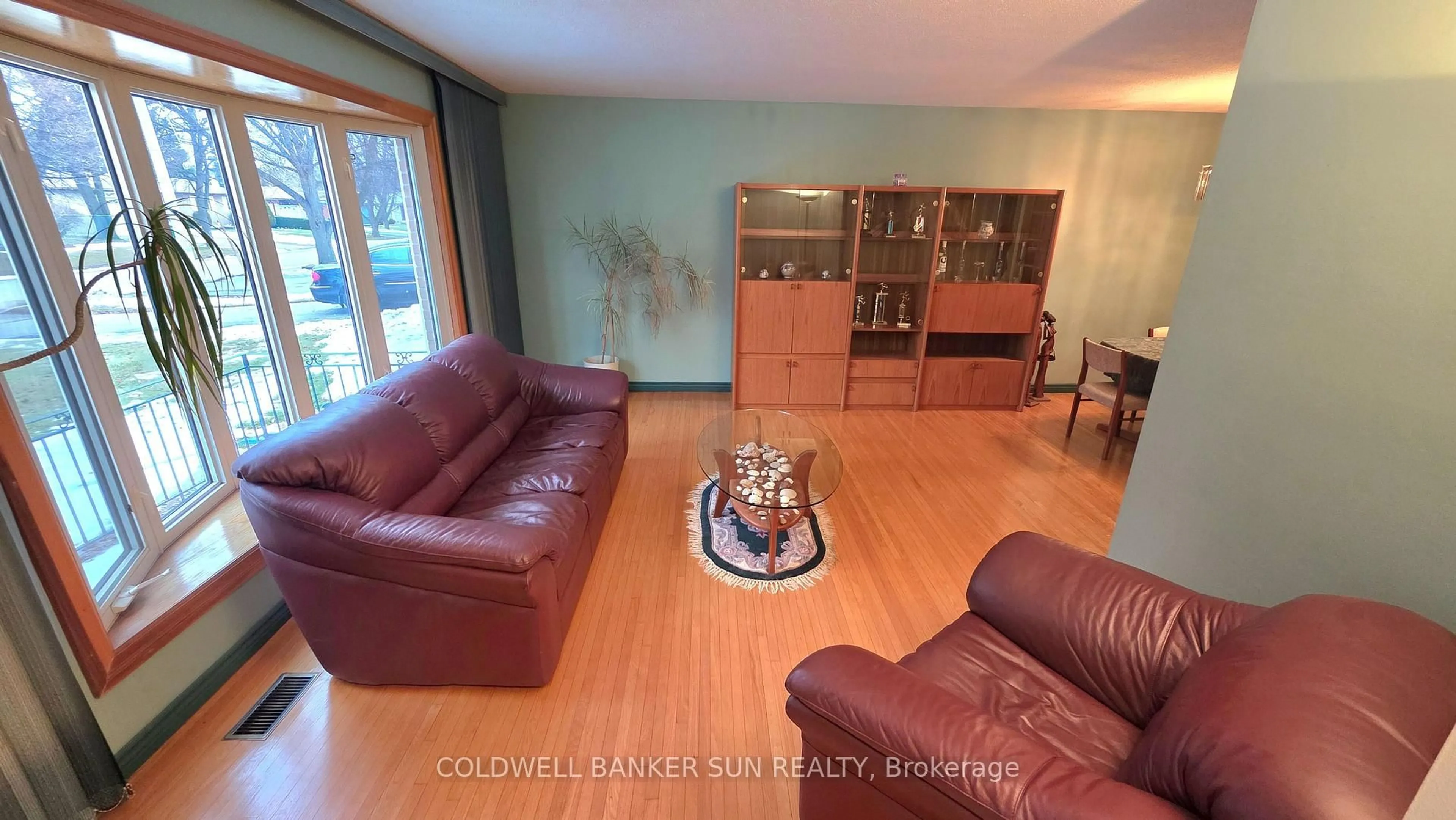 Living room with furniture, wood/laminate floor for 23 Brookdale Cres, Brampton Ontario L6T 1M8