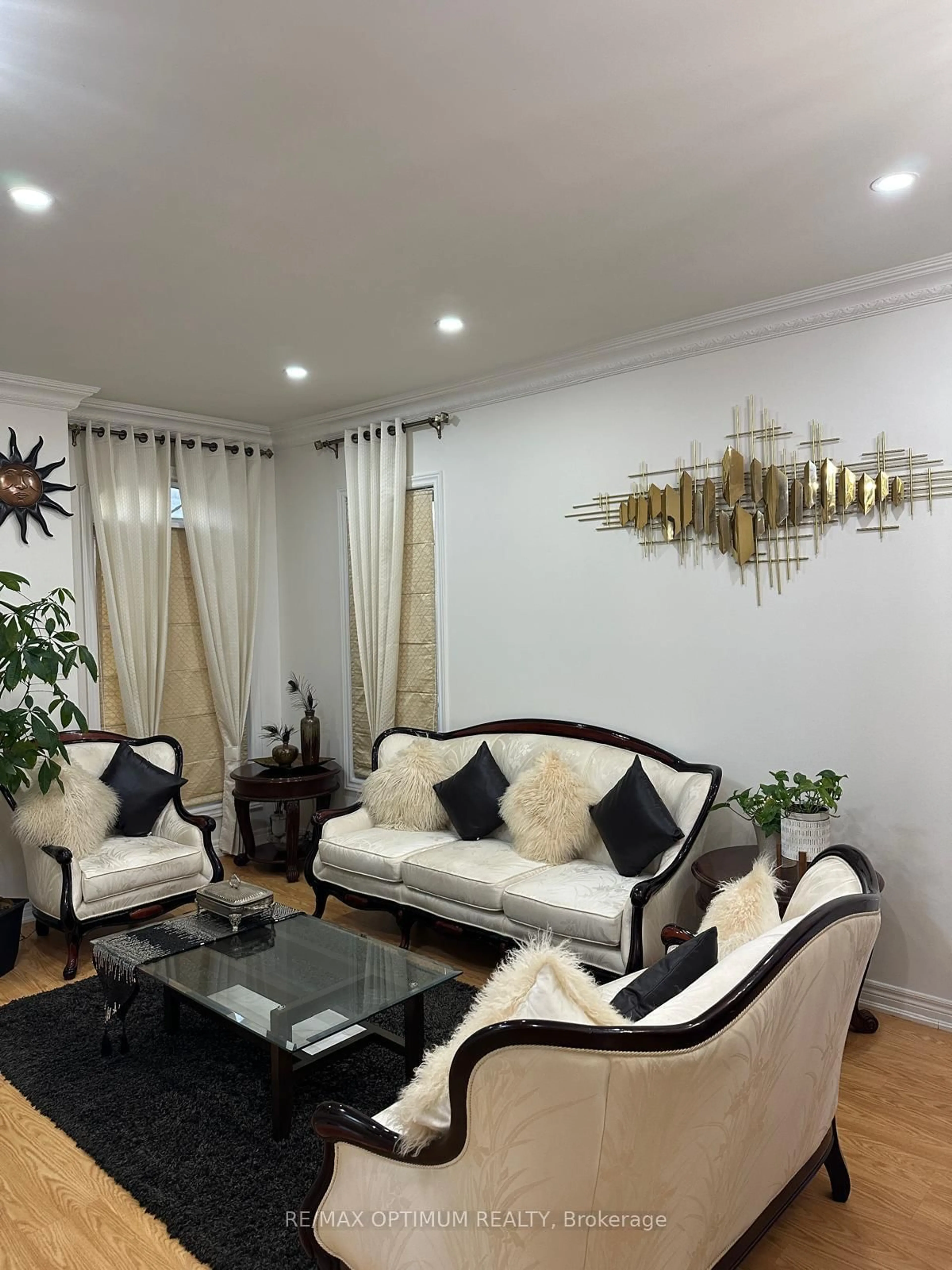 Living room with furniture, wood/laminate floor for 100 Turquoise Cres, Brampton Ontario L6P 0Z8