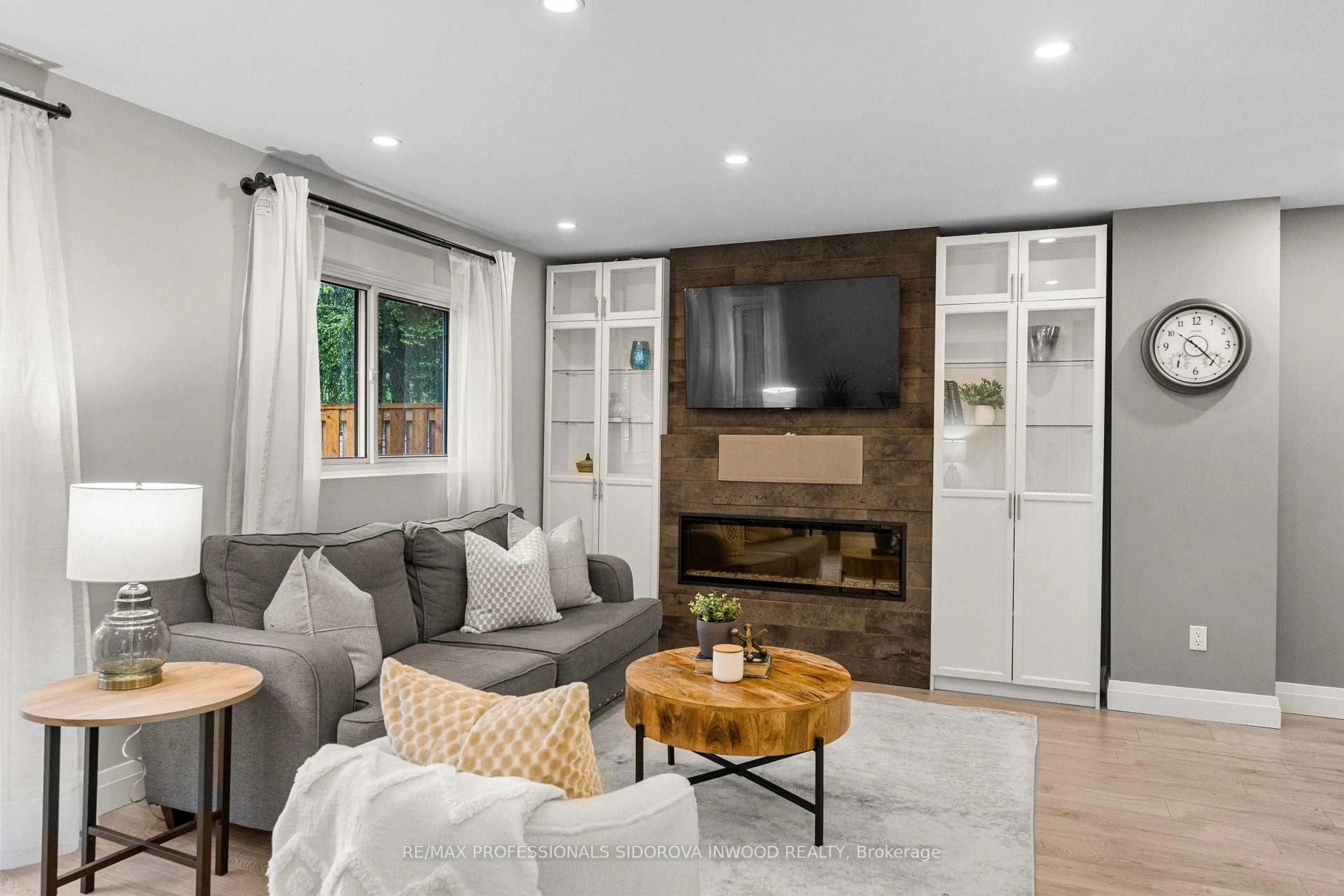 Living room with furniture, wood/laminate floor for 1050 Shawnmarr Rd #129, Mississauga Ontario L5H 3V1