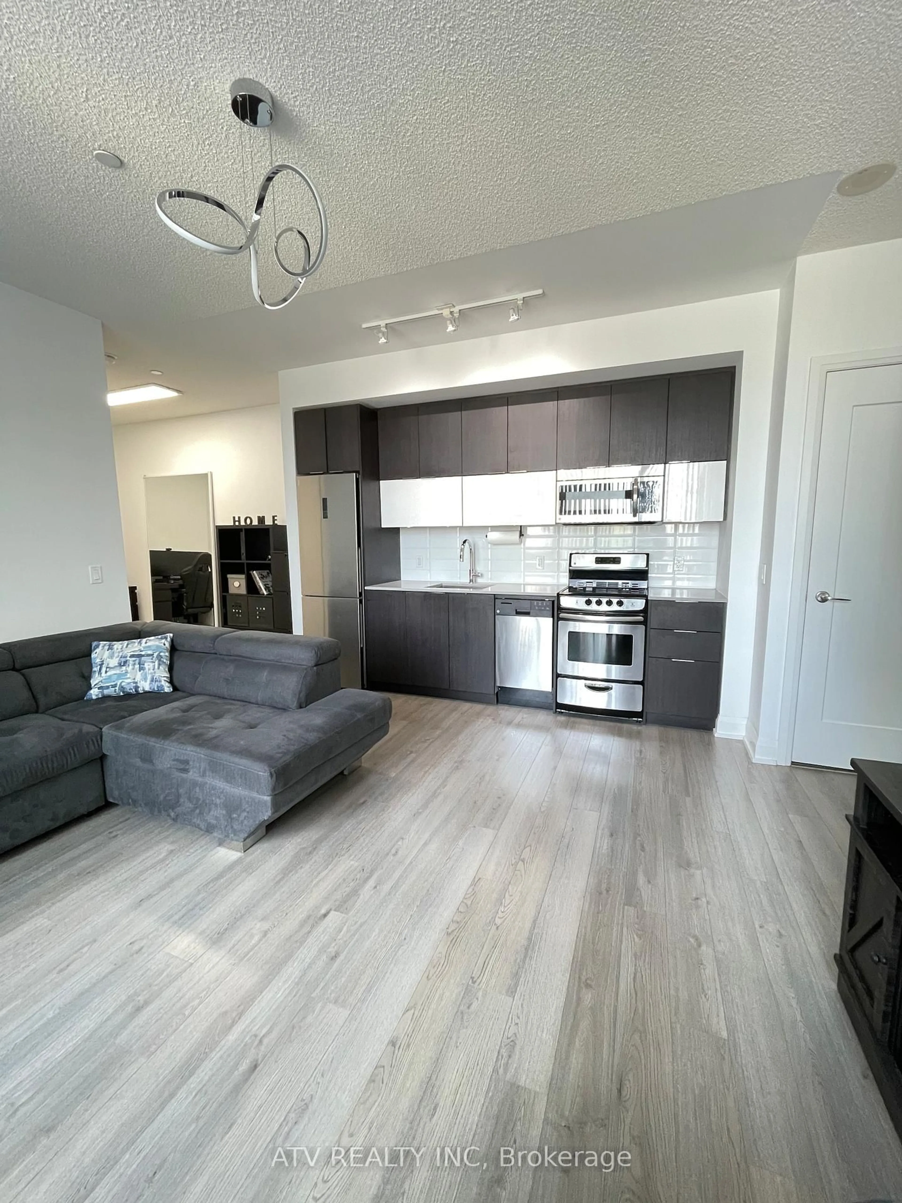 Open concept kitchen, wood/laminate floor for 56 Annie Craig Dr #309, Toronto Ontario M8V 0C5