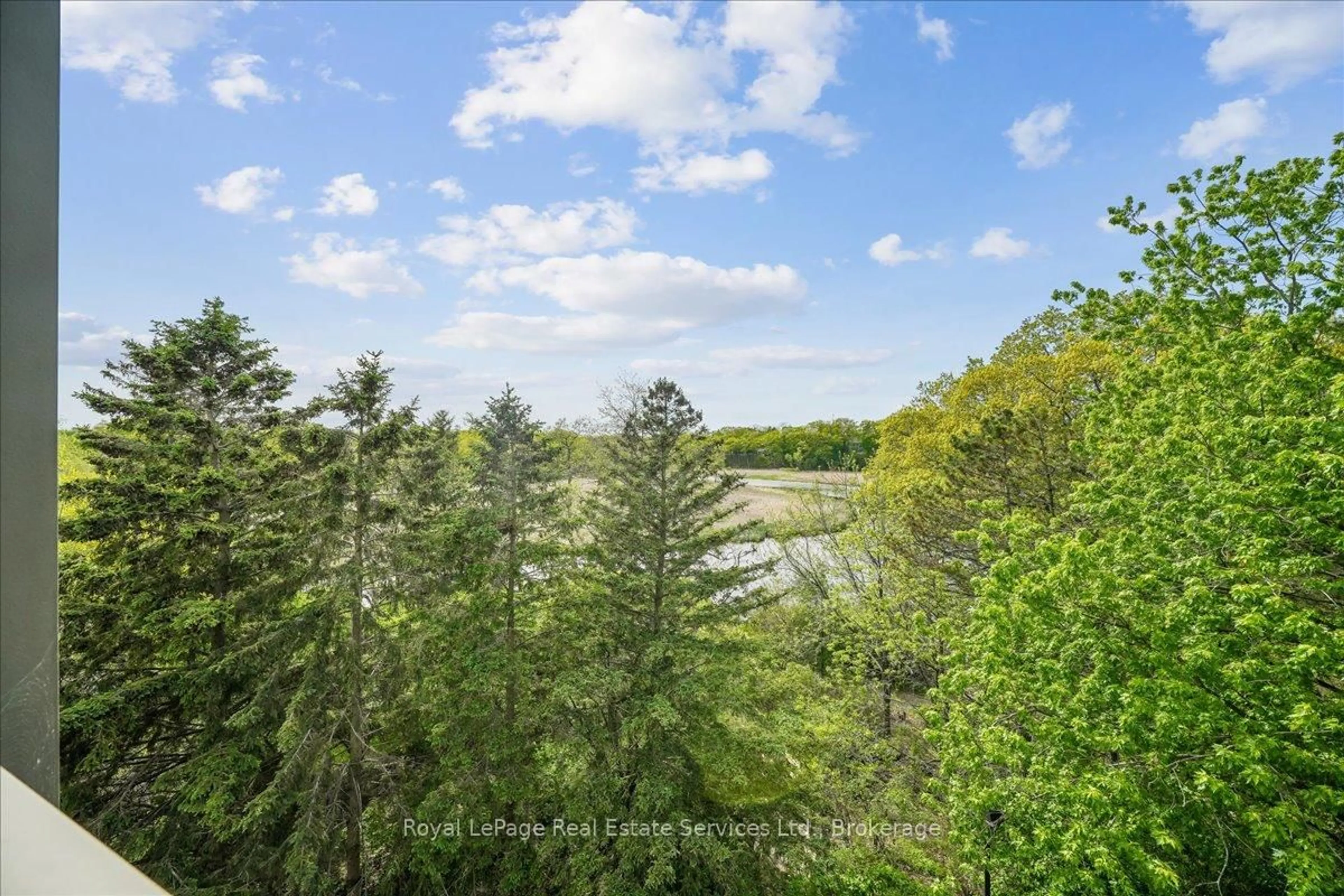 A pic from outside/outdoor area/front of a property/back of a property/a pic from drone, forest/trees view for 2511 Lakeshore Rd #405, Oakville Ontario L6L 6L9