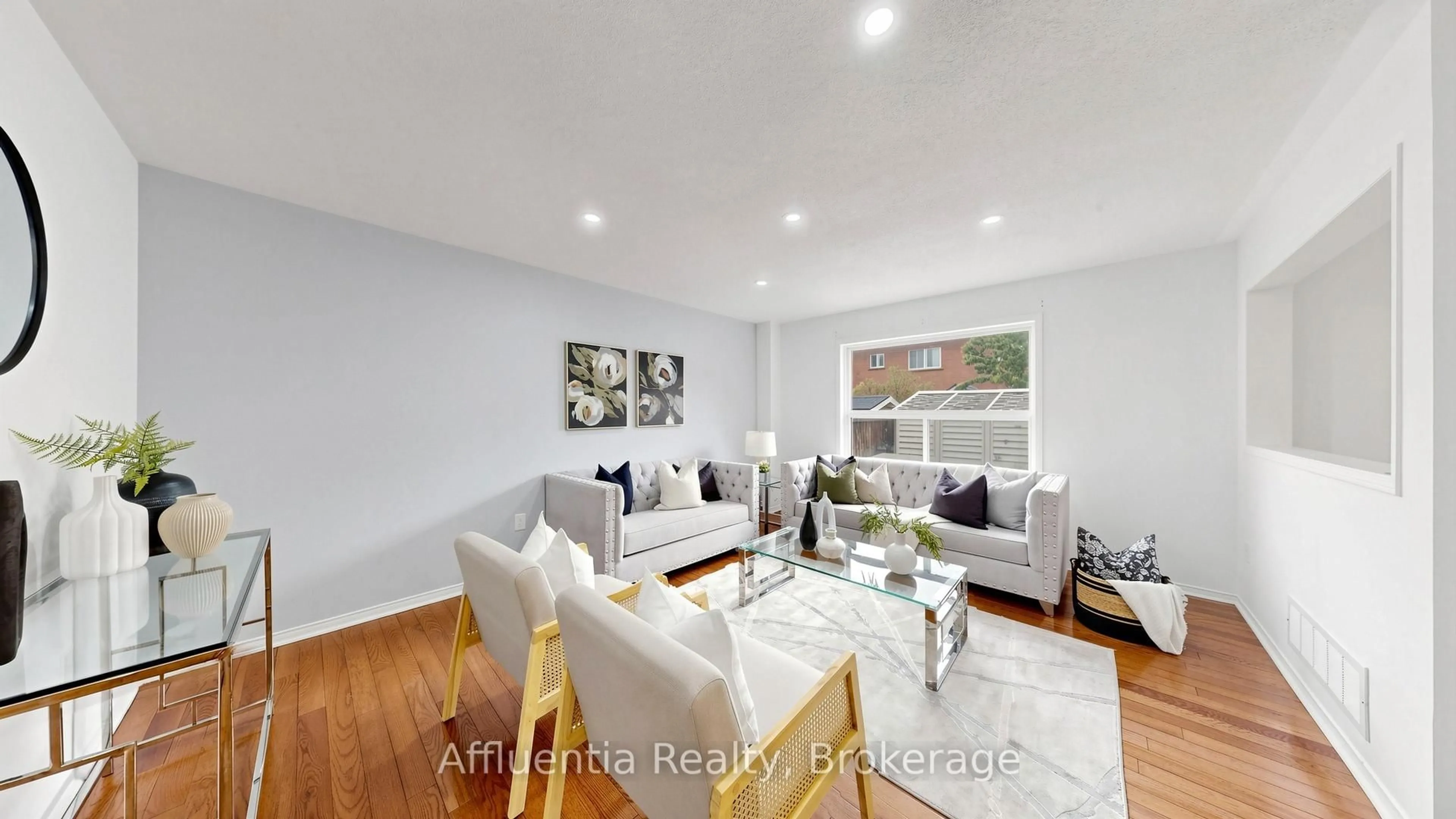 Living room with furniture, wood/laminate floor for 5714 Jenvic Grve, Mississauga Ontario L5M 7B4