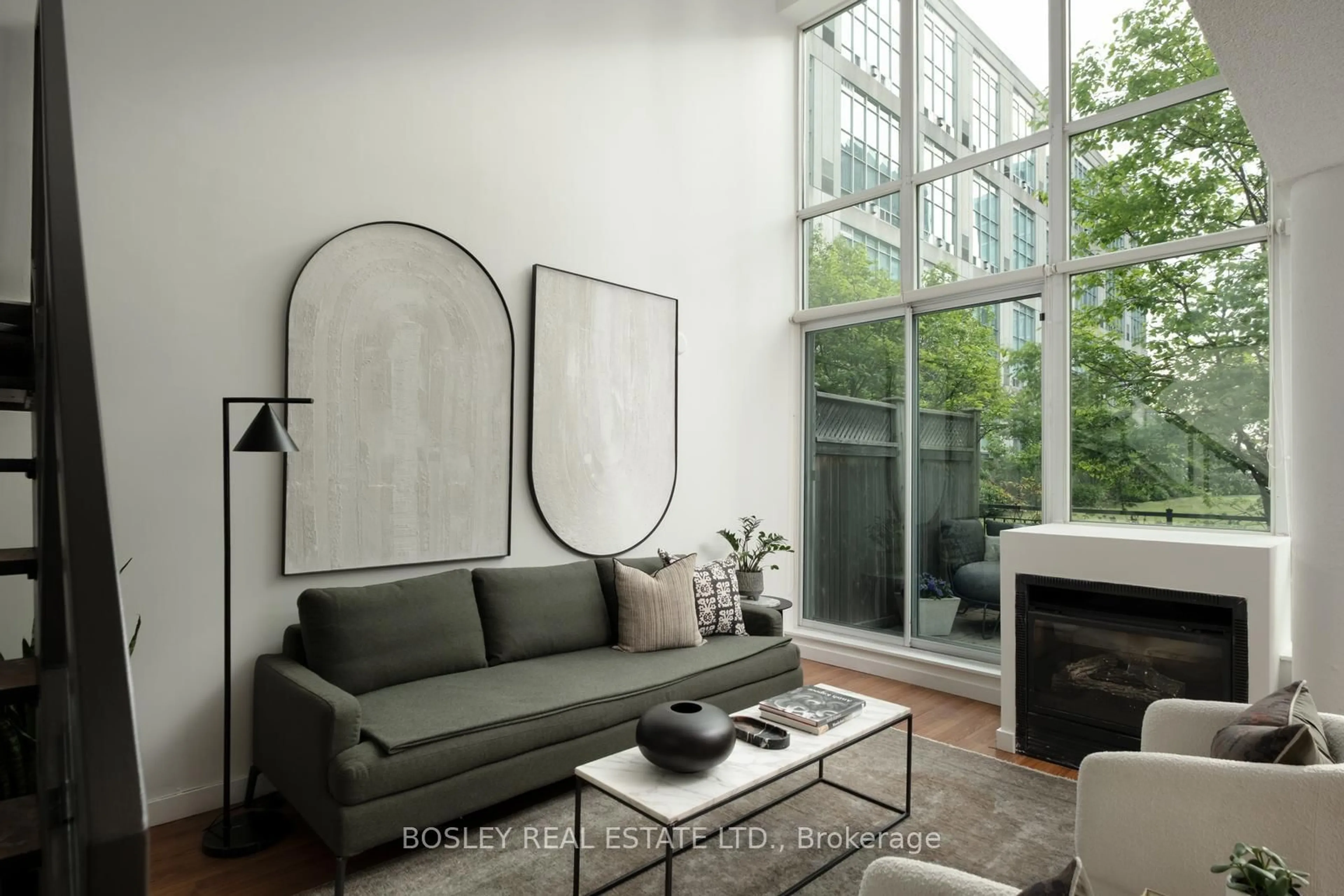 Living room with furniture, cement floor for 250 Manitoba St #503, Toronto Ontario M8Y 4G8