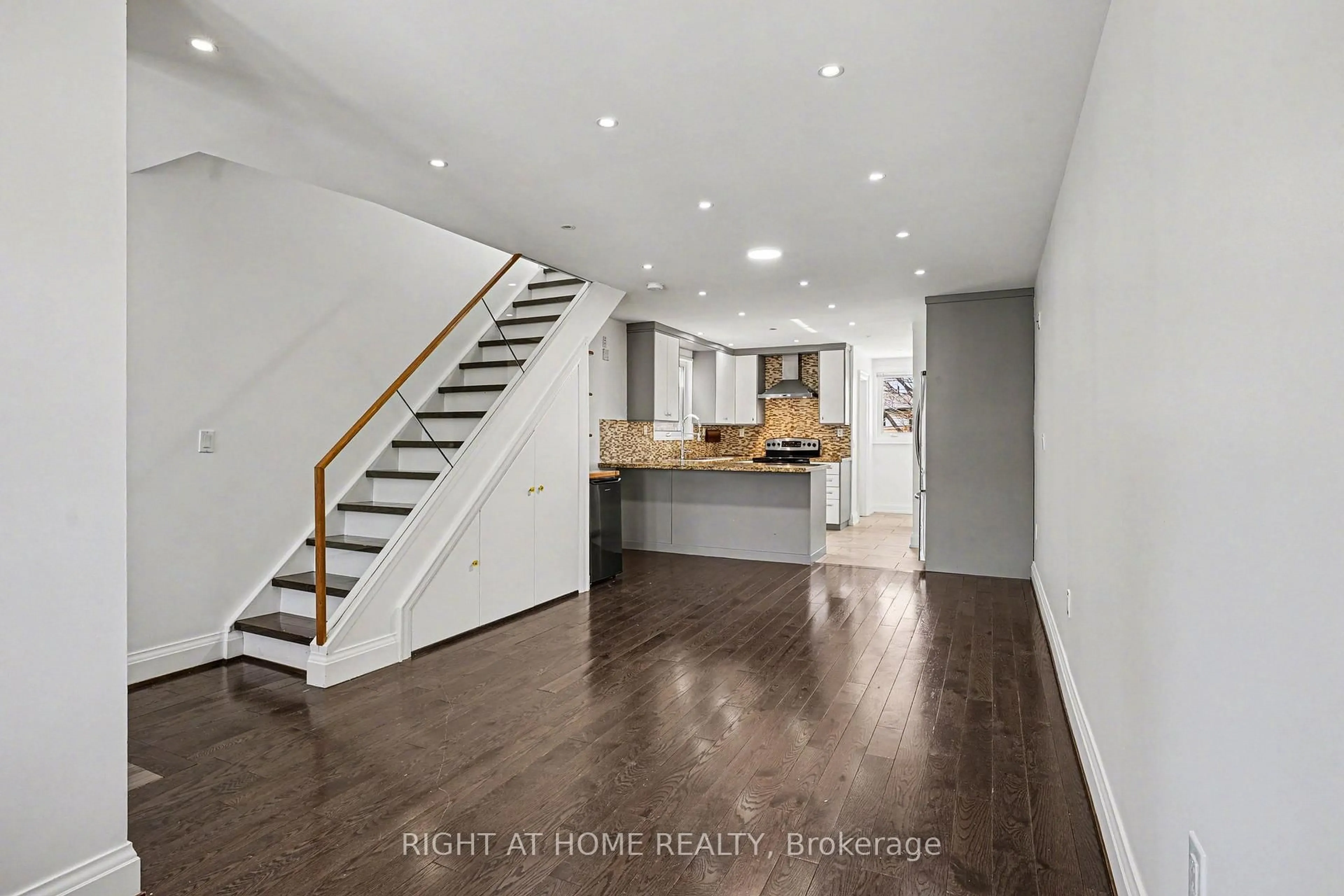 Open concept kitchen, wood/laminate floor for 174 Rosethorn Ave, Toronto Ontario M6N 3L4