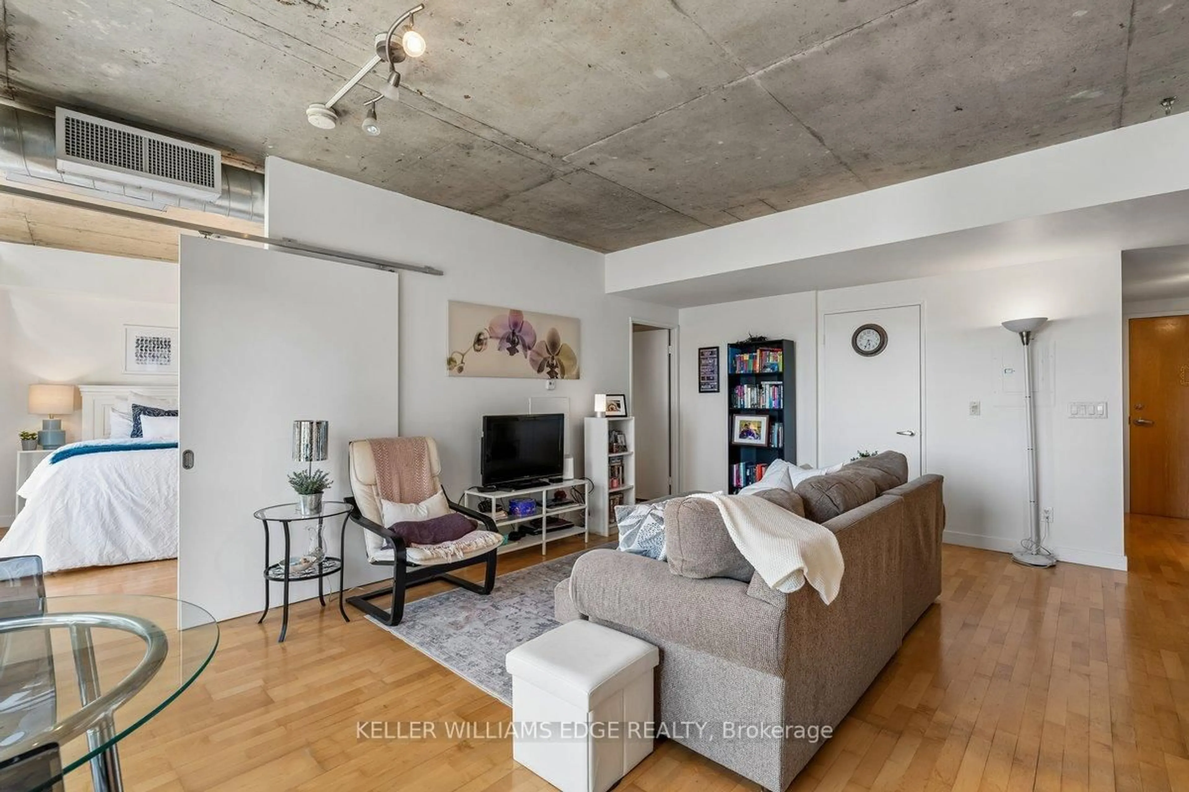 Living room with furniture, cement floor for 1375 Dupont St #612, Toronto Ontario M6H 4J8