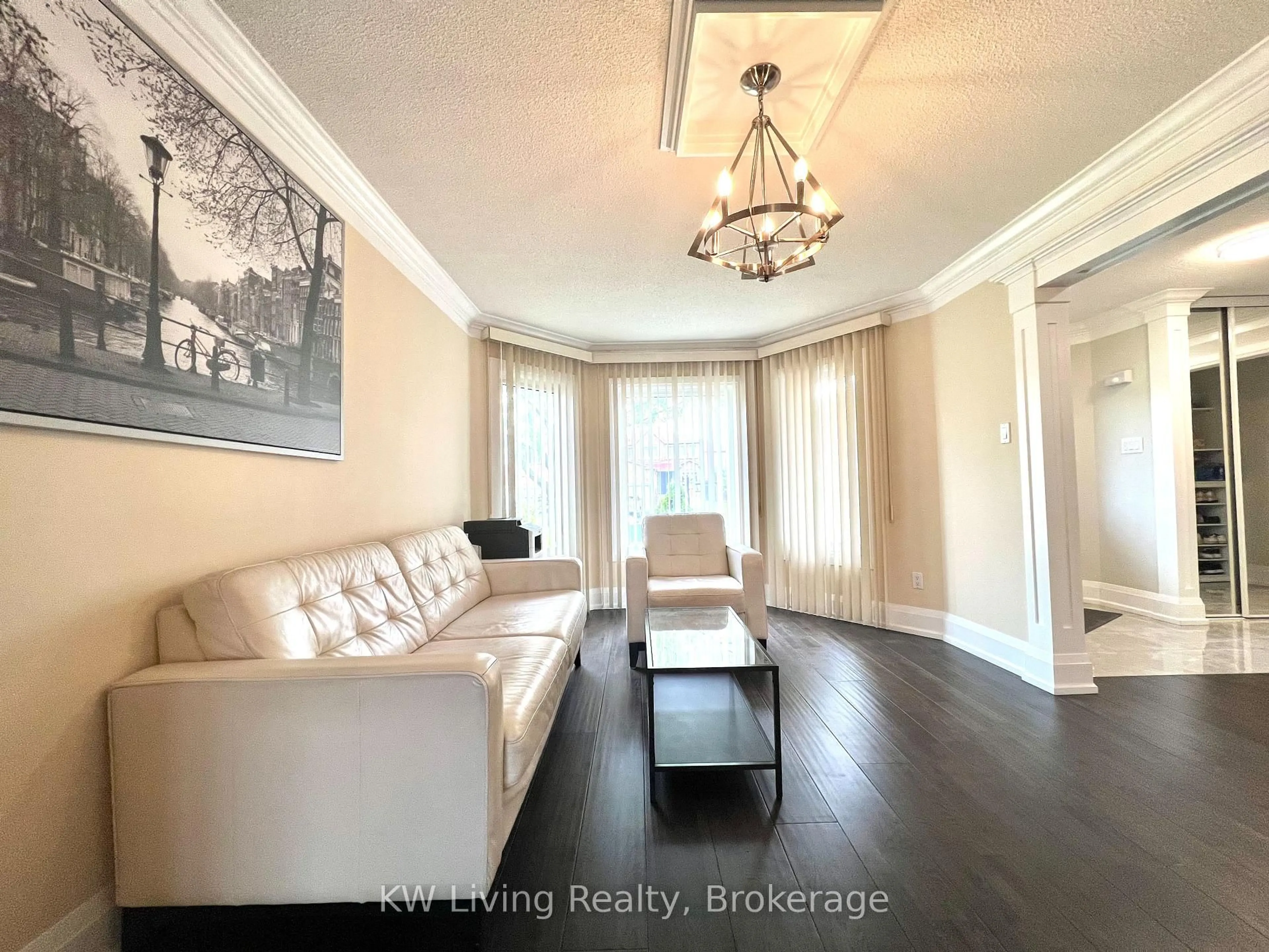 Living room with furniture, wood/laminate floor for 128 Palomino Dr, Mississauga Ontario L4Z 3G5