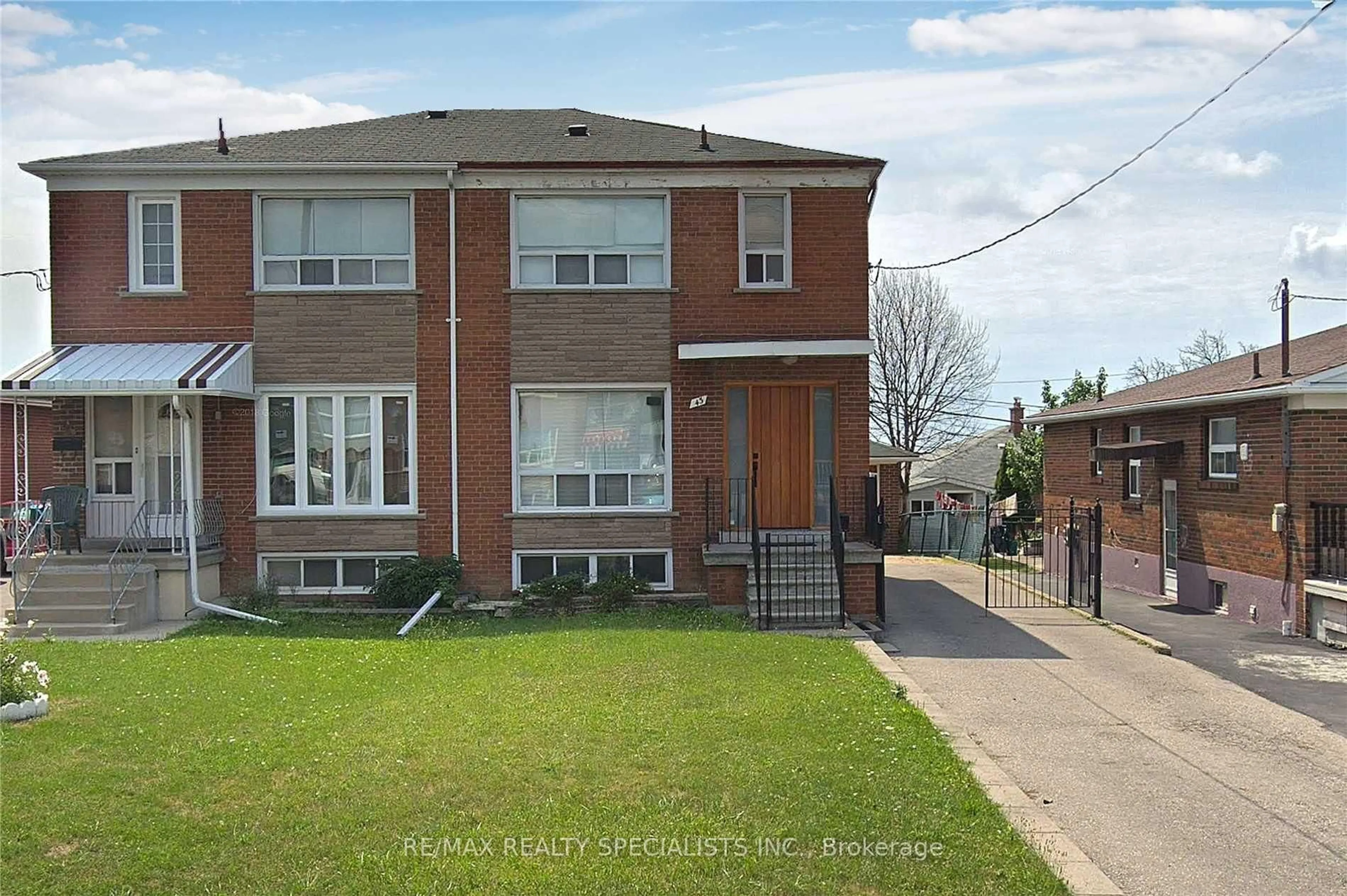Home with brick exterior material, street for 43 Thurrock Rd, Toronto Ontario M3L 1P5