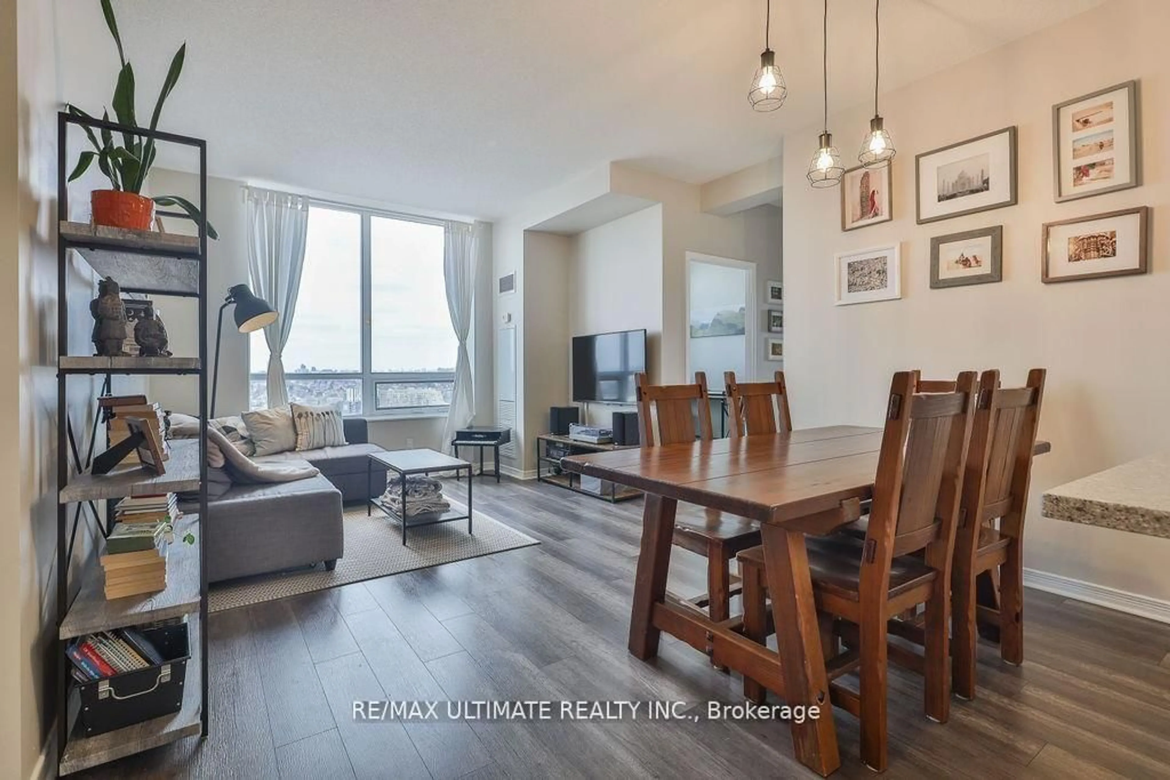 Living room with furniture, wood/laminate floor for 60 Heintzman St #2404, Toronto Ontario M6P 5A1