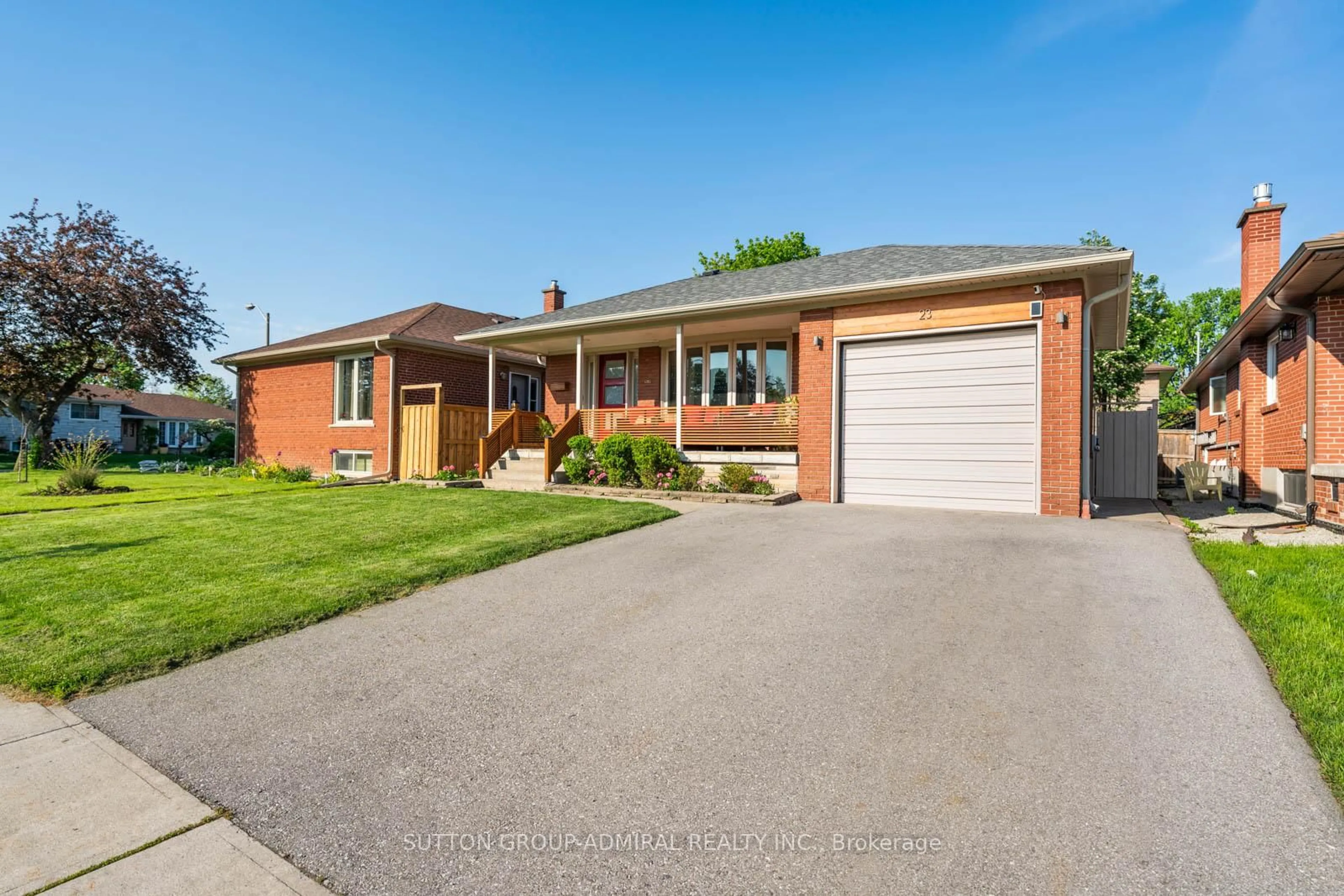 Home with brick exterior material, street for 23 Groverdale Rd, Toronto Ontario M9C 3M7
