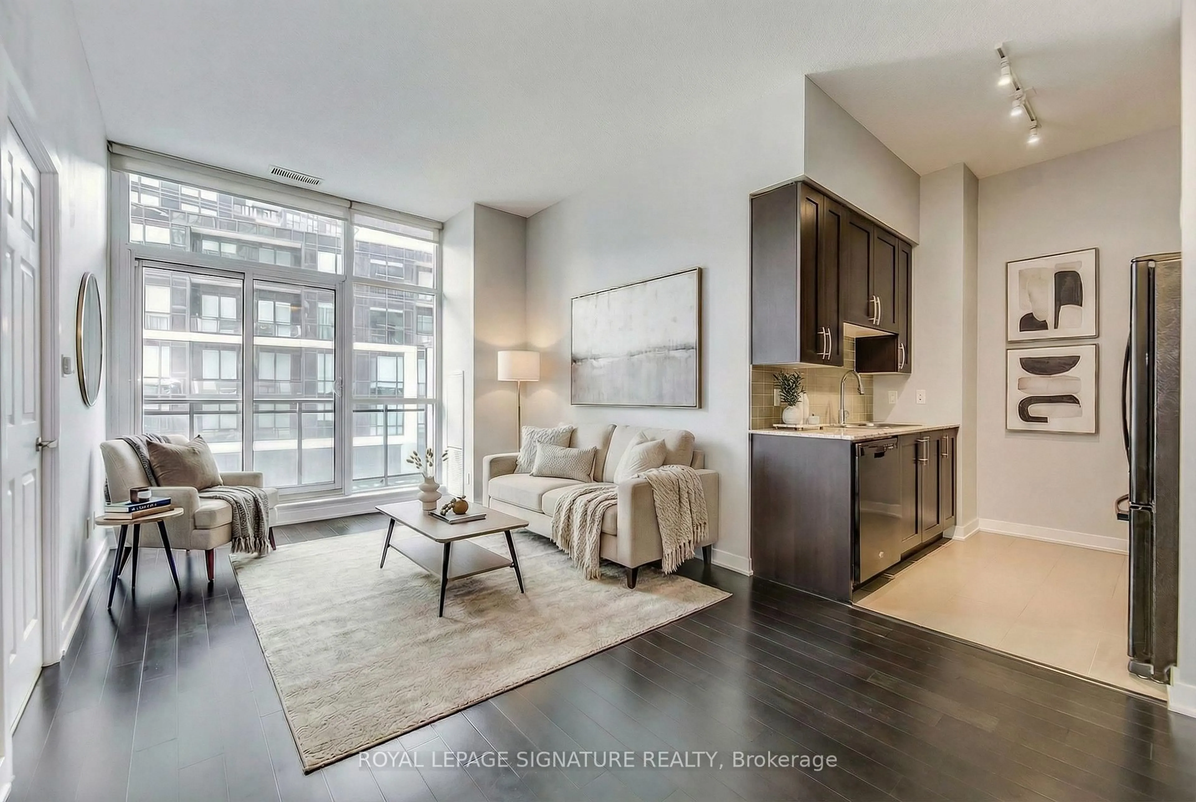 Living room with furniture, unknown for 4070 Confederation Pkwy #311, Mississauga Ontario L5B 0E9