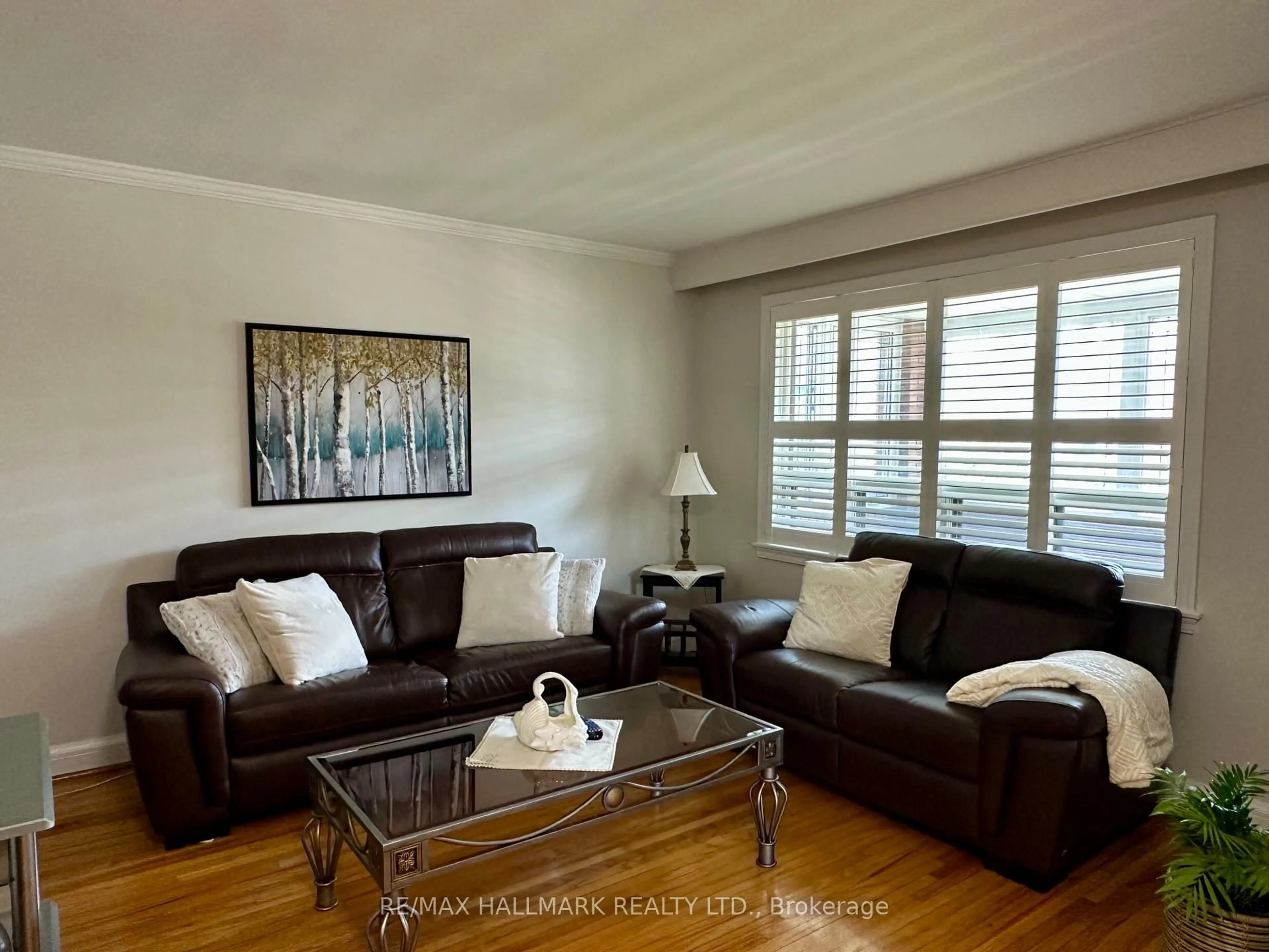 Living room with furniture, wood/laminate floor for 44 Kirby Rd, Toronto Ontario M3L 1B4