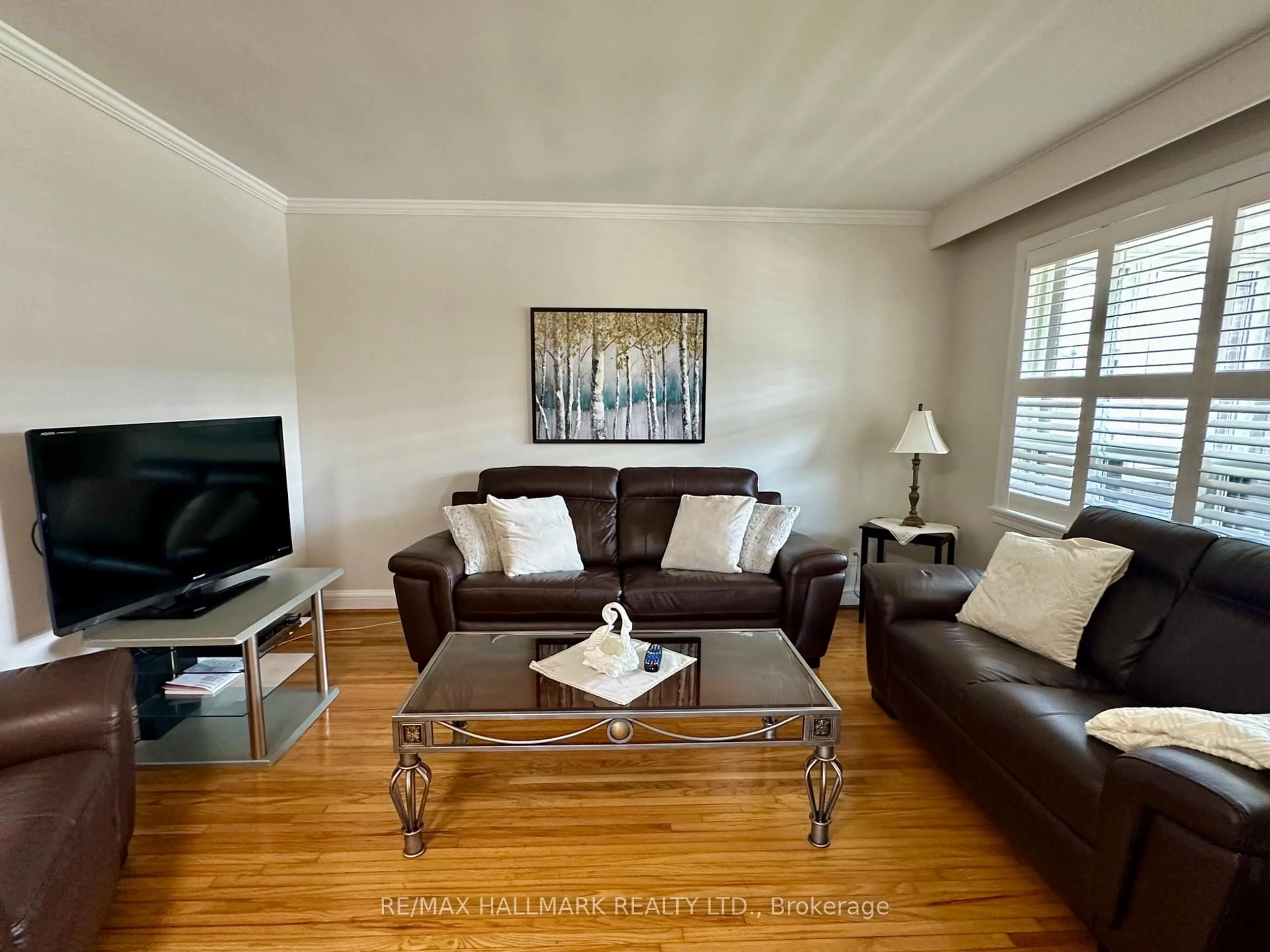 Living room with furniture, wood/laminate floor for 44 Kirby Rd, Toronto Ontario M3L 1B4
