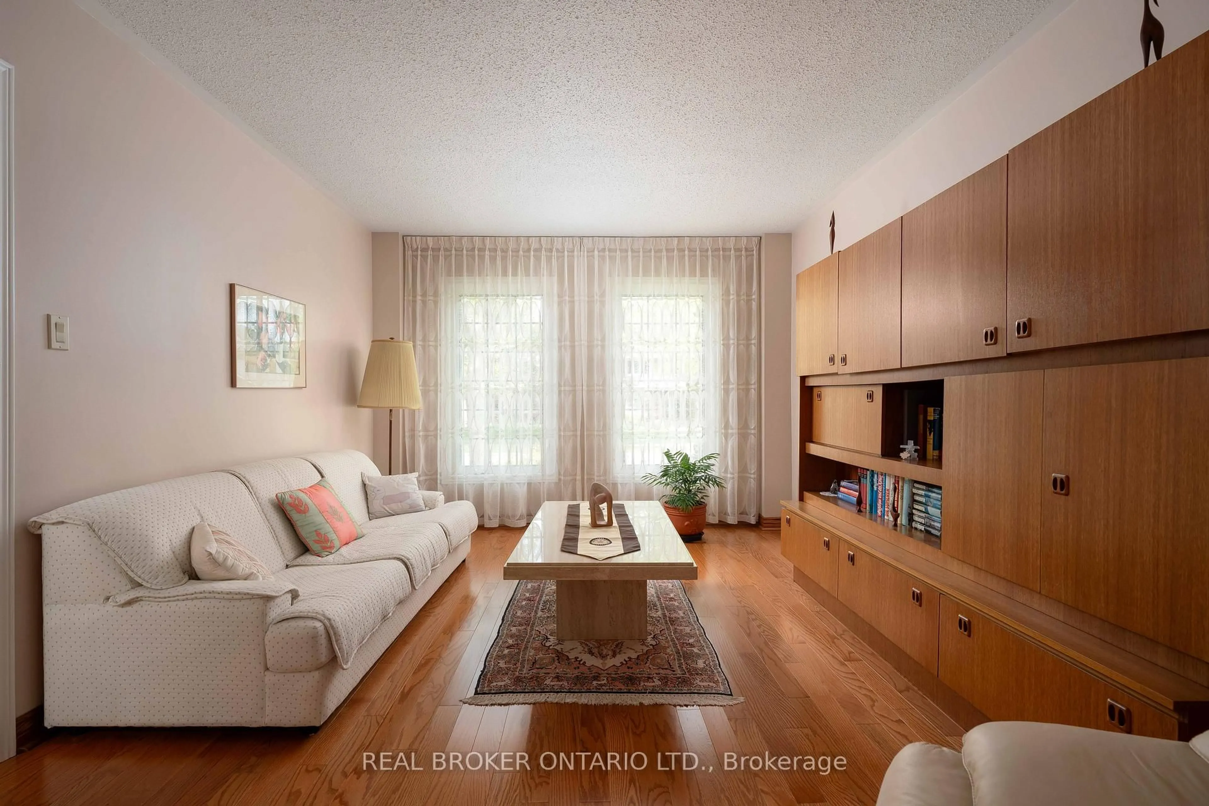 Living room with furniture, wood/laminate floor for 1128 Mayfair Rd, Oakville Ontario L6M 1G8