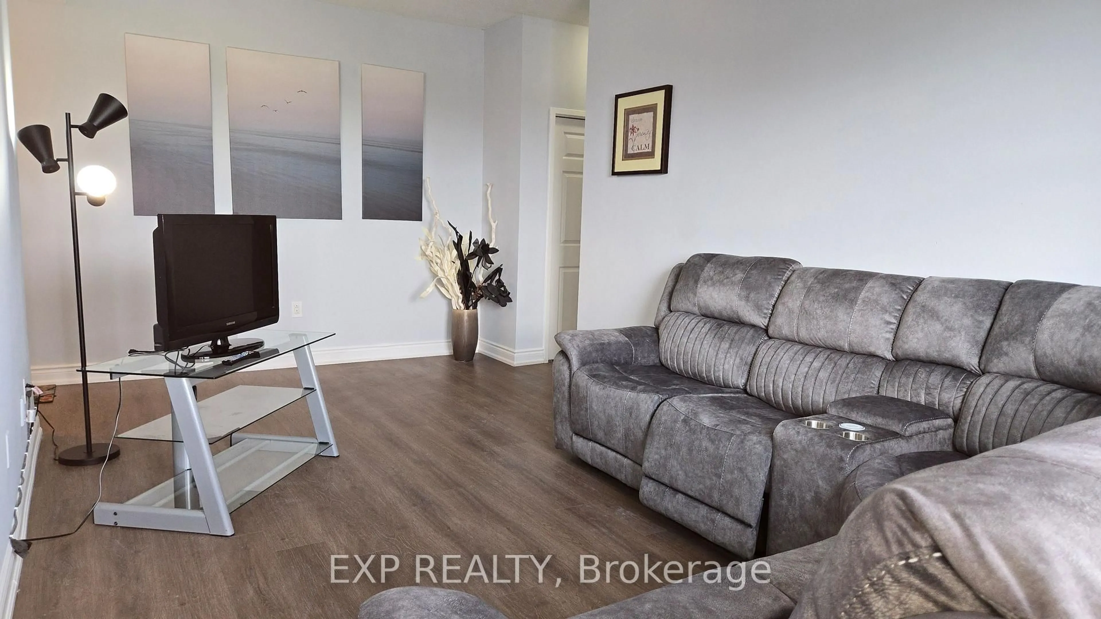 Living room with furniture, wood/laminate floor for 2485 Woking Cres #508, Mississauga Ontario L5K 1Z6