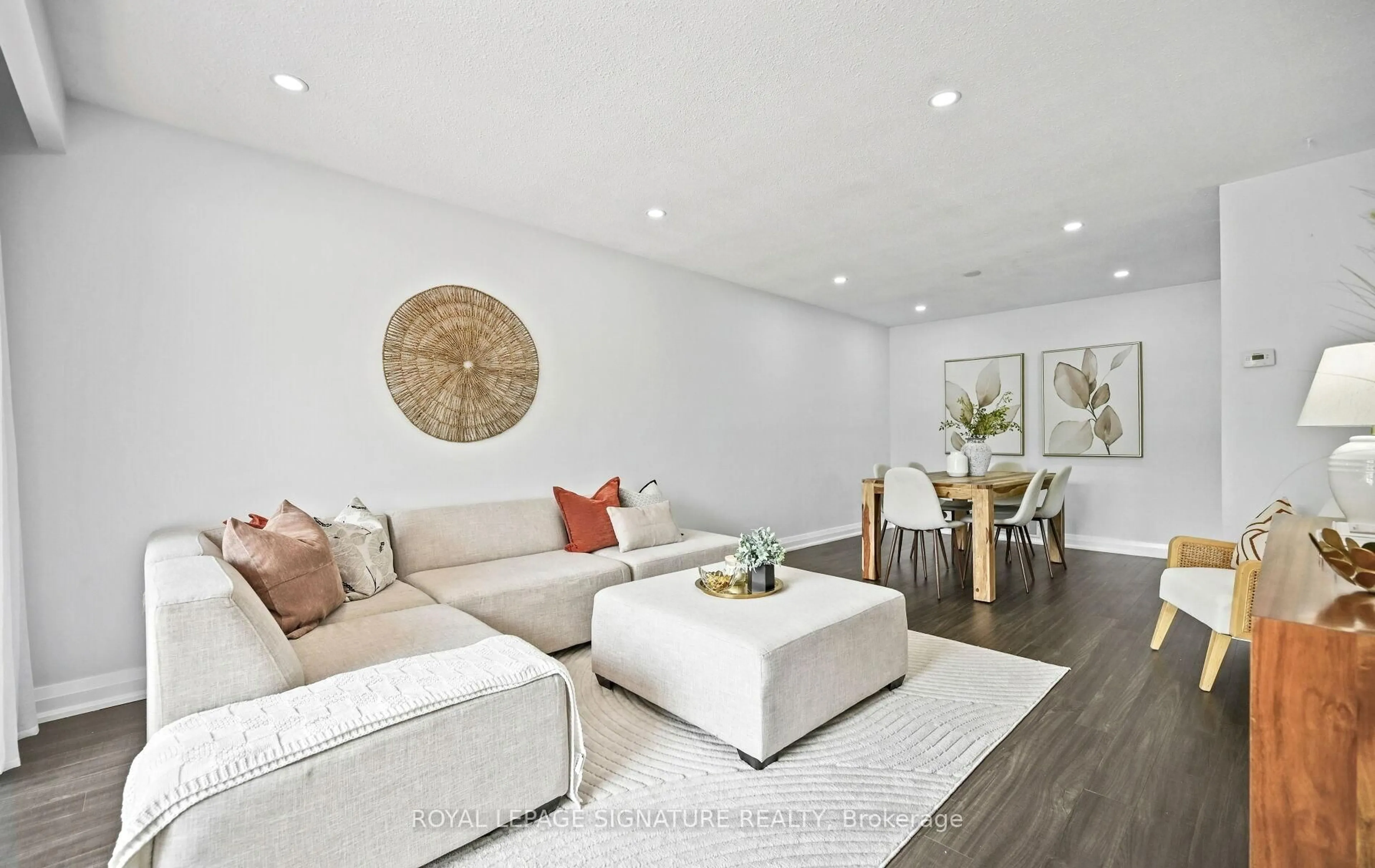 Living room with furniture, wood/laminate floor for 23 Abell Dr, Brampton Ontario L6V 2W1