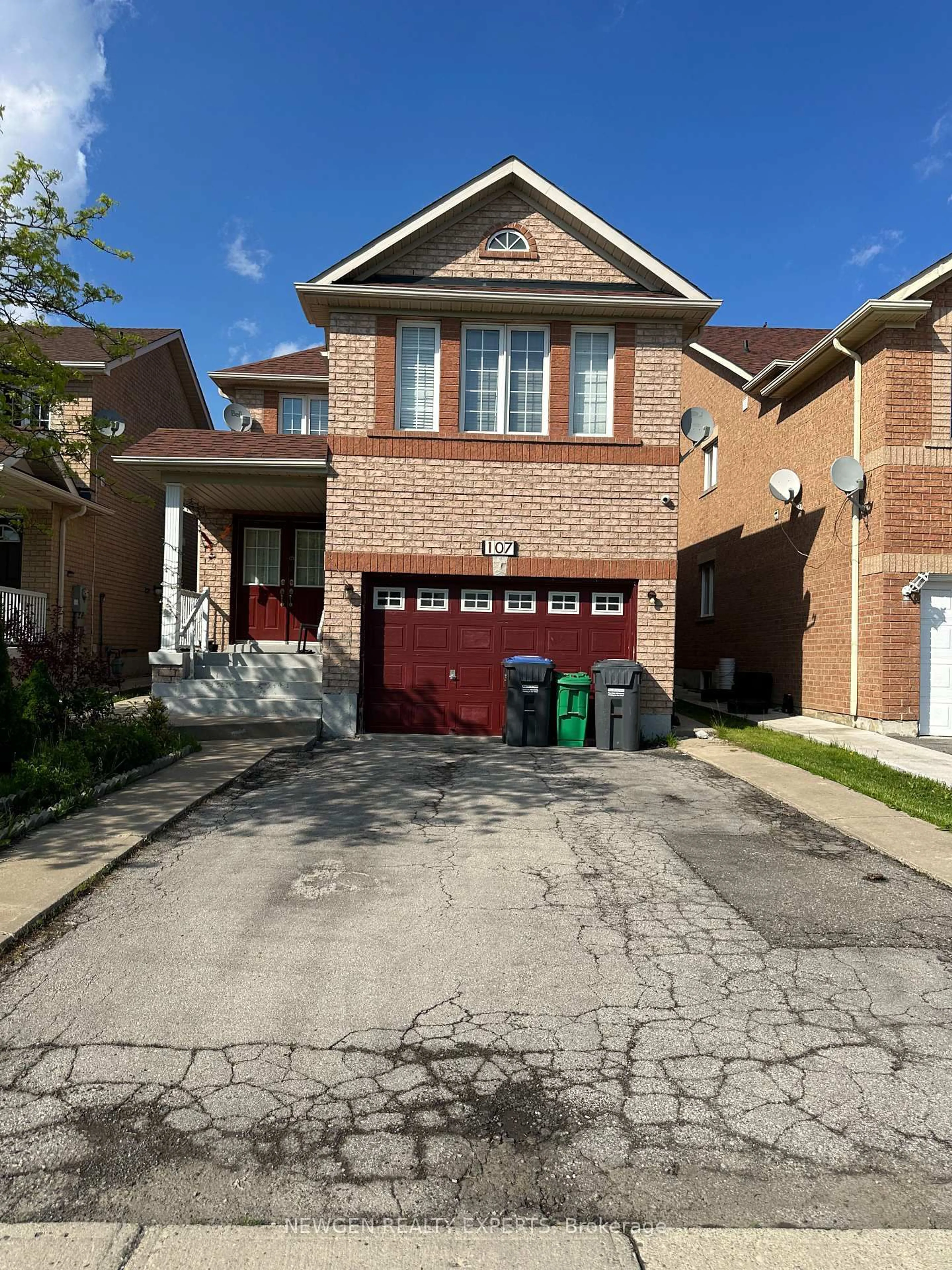 Home with brick exterior material, street for 107 Rollingwood Dr, Brampton Ontario L6Y 5P9