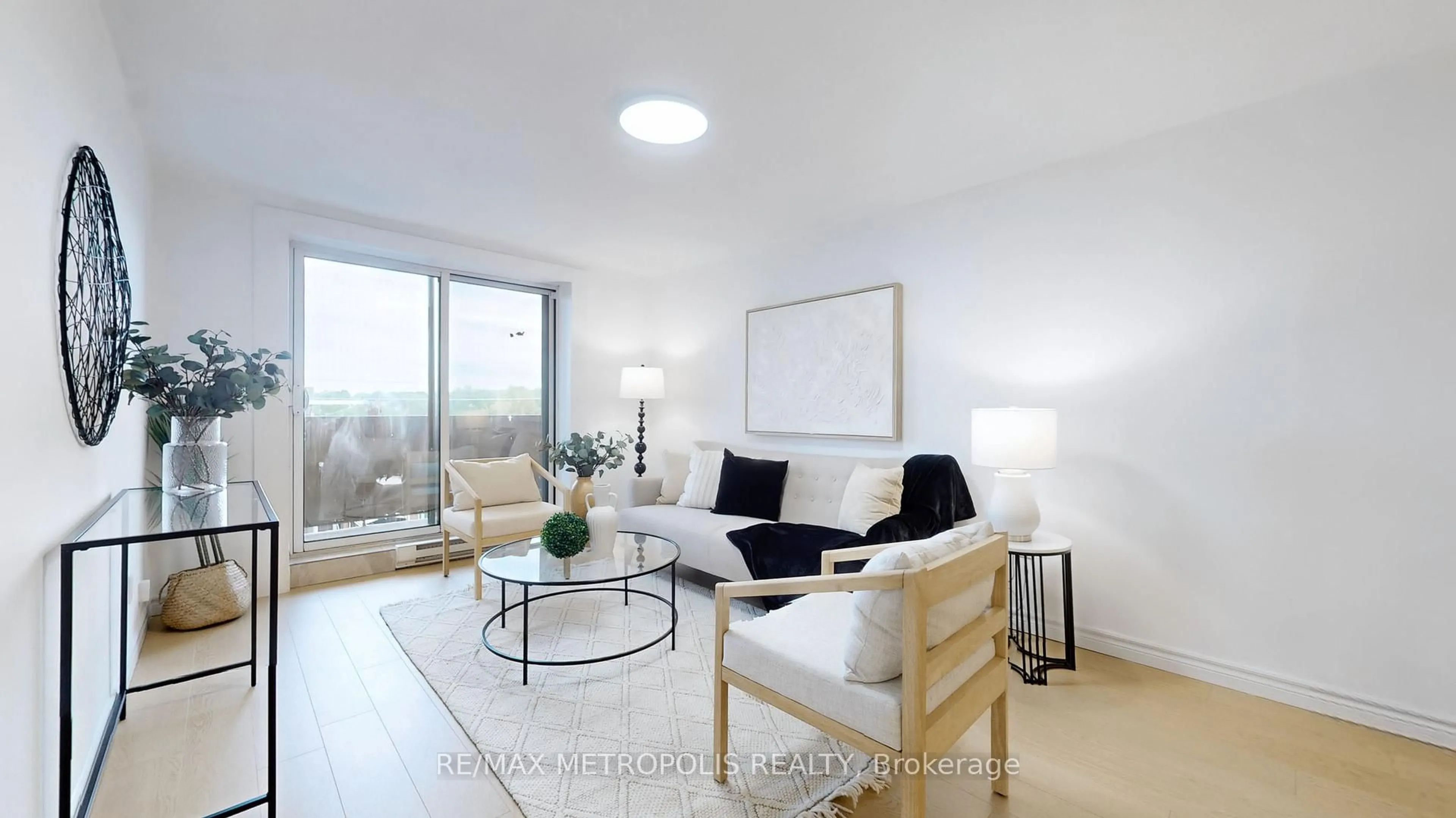 Living room with furniture, wood/laminate floor for 1445 Wilson Ave #106, Toronto Ontario M3M 1J5