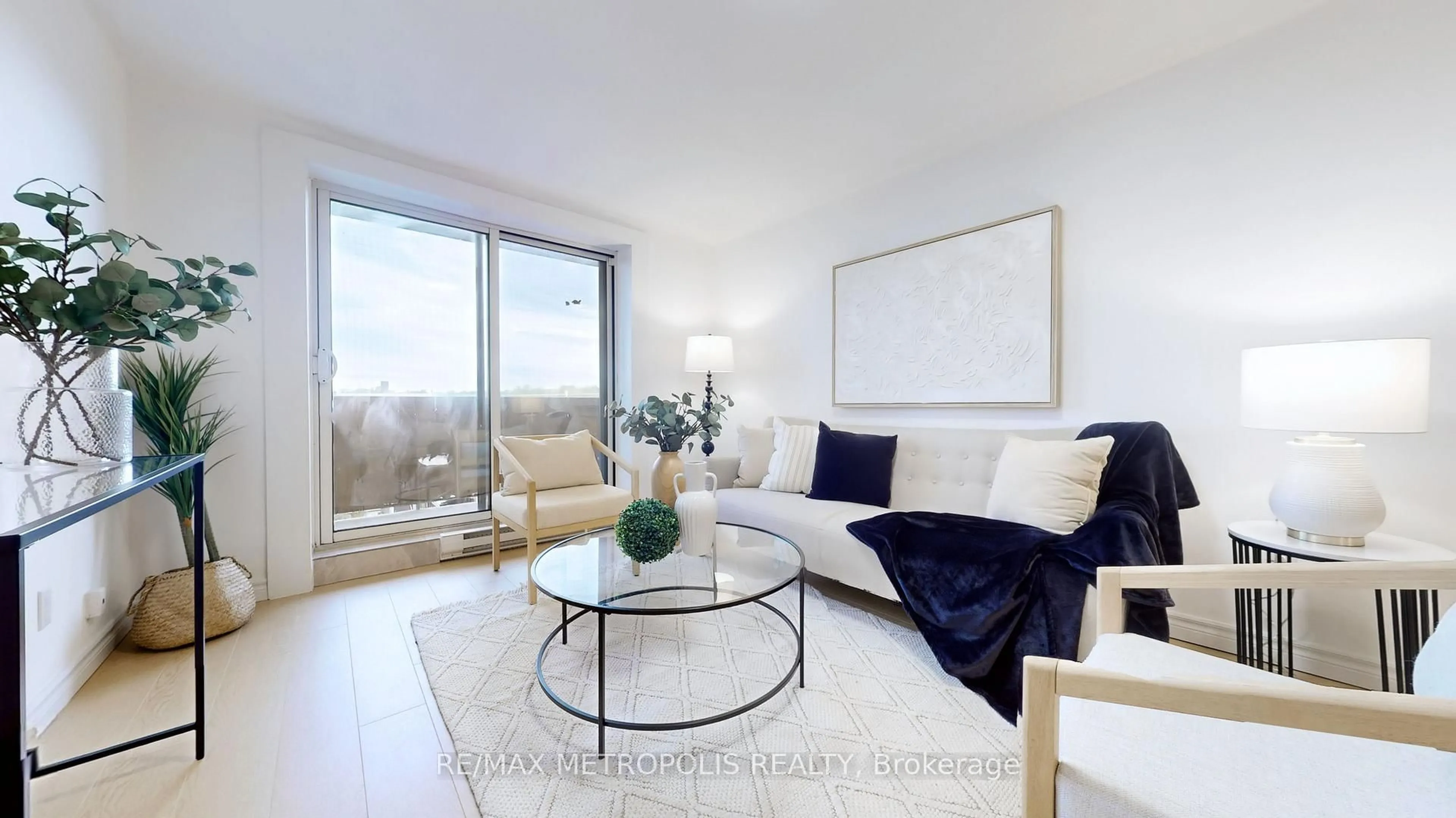 Living room with furniture, wood/laminate floor for 1445 Wilson Ave #106, Toronto Ontario M3M 1J5