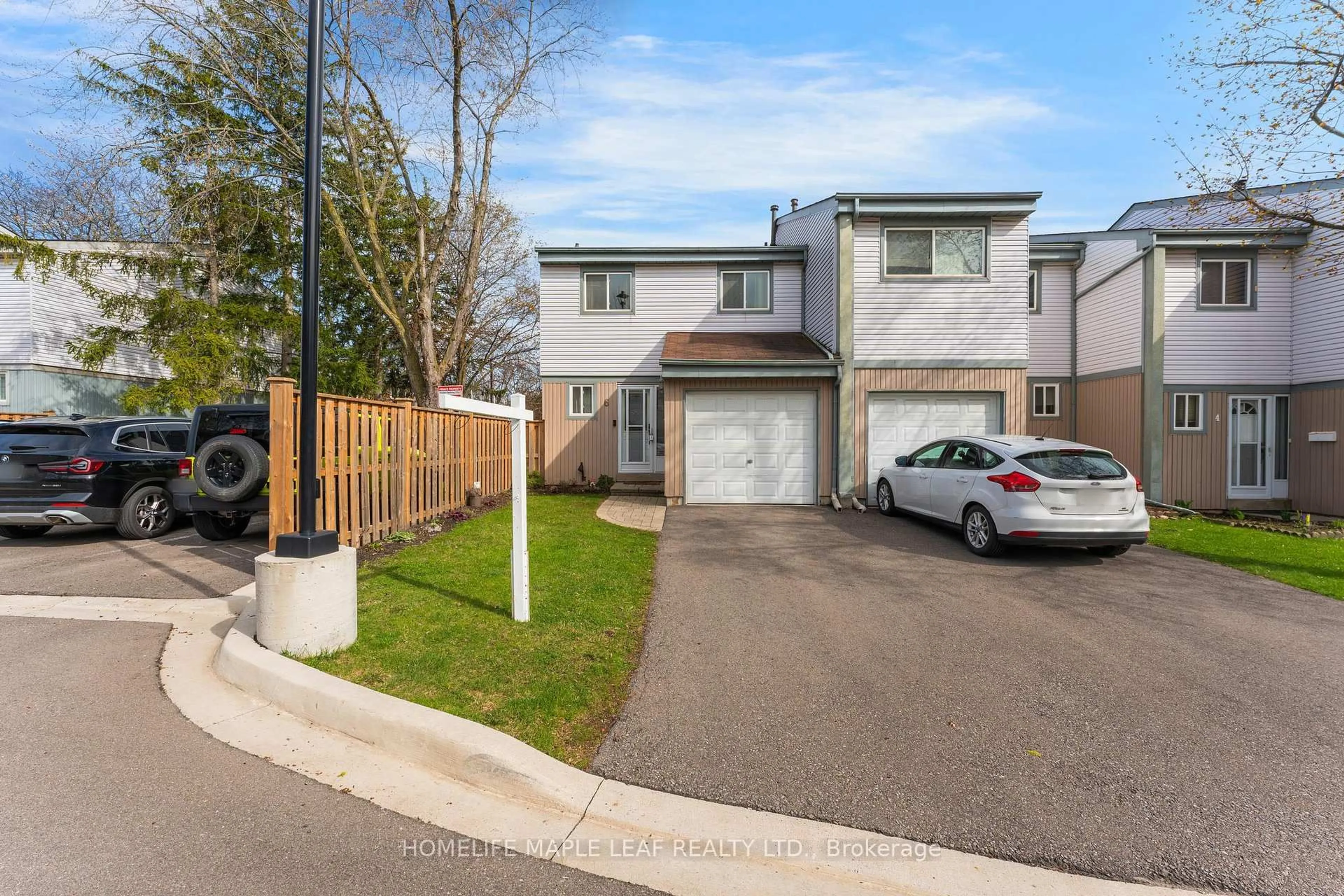 A pic from outside/outdoor area/front of a property/back of a property/a pic from drone, street for 121 Falconer Dr #6, Mississauga Ontario L5N 2K8