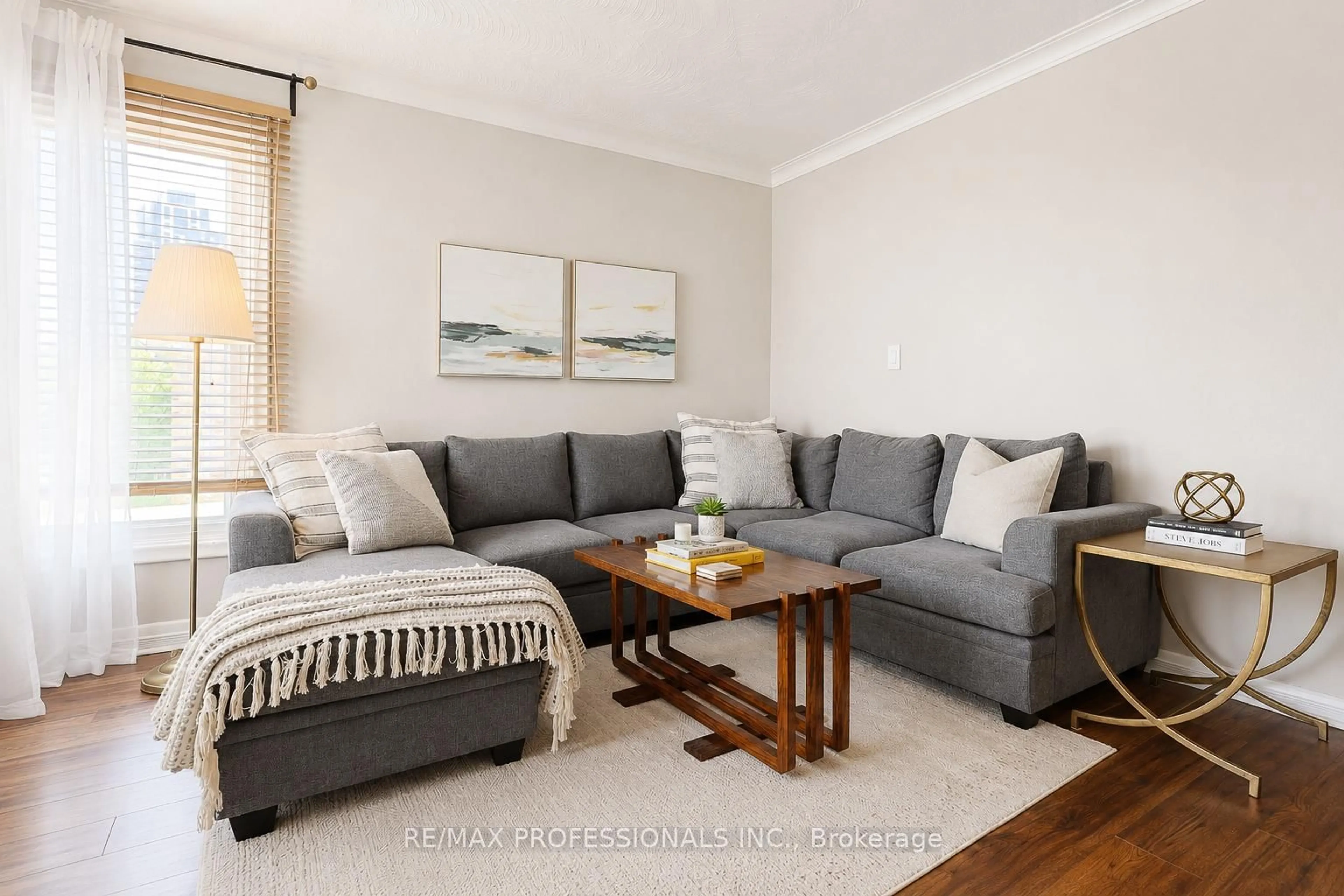 Living room with furniture, wood/laminate floor for 39 Sealcove Dr, Toronto Ontario M9C 2C7