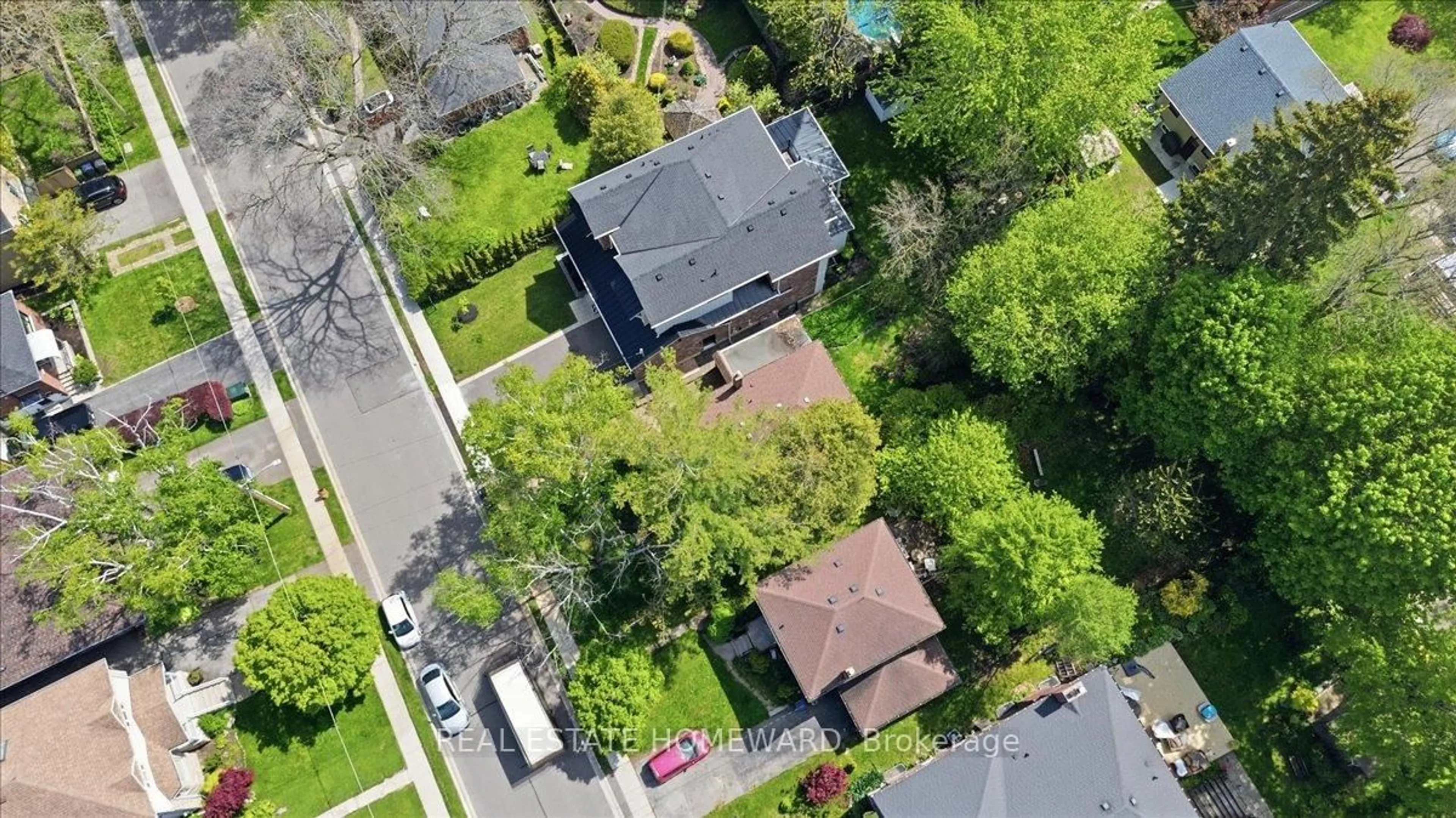 A pic from outside/outdoor area/front of a property/back of a property/a pic from drone, street for 12 Thirty Seventh St, Toronto Ontario M8W 3L6