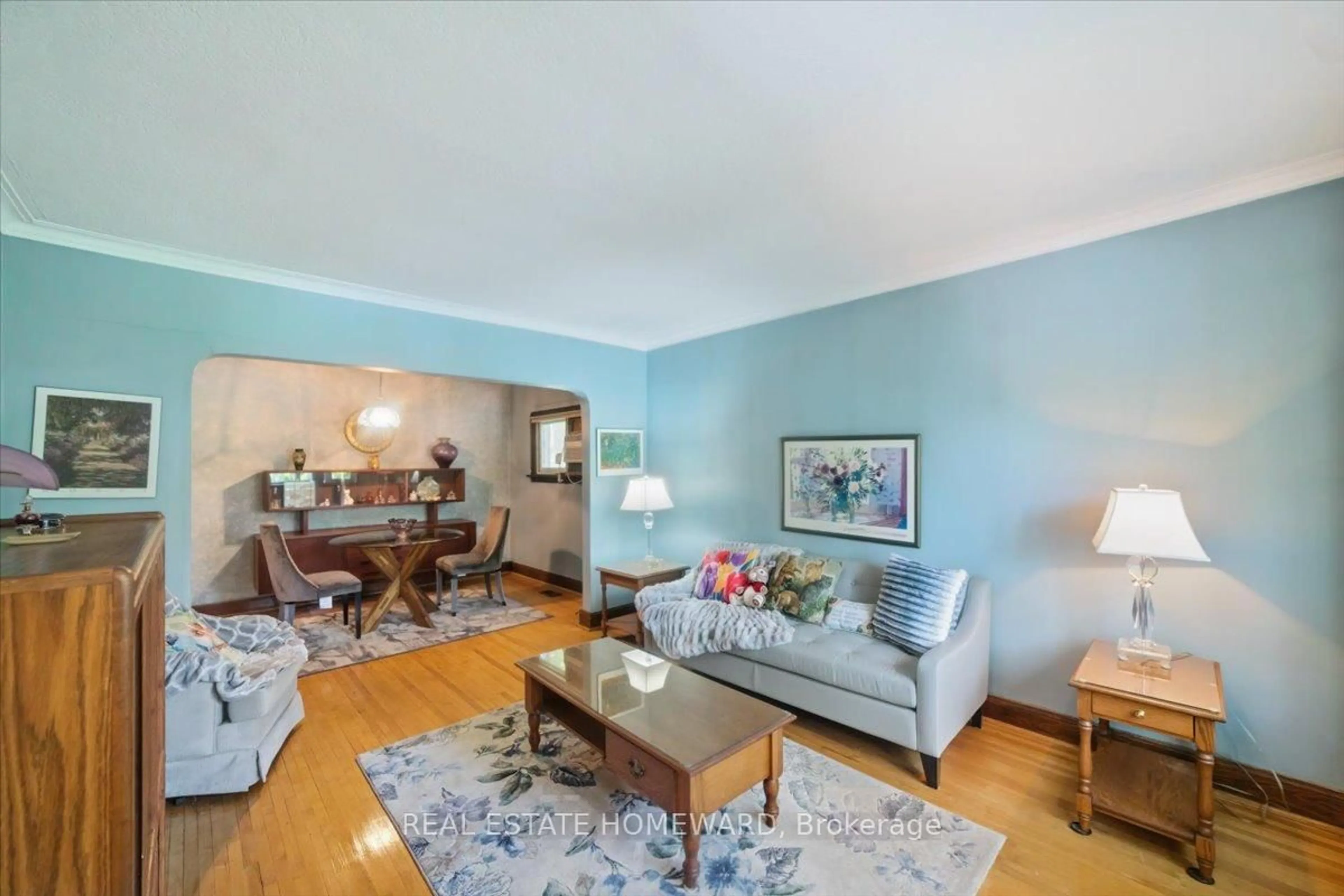 Living room with furniture, wood/laminate floor for 12 Thirty Seventh St, Toronto Ontario M8W 3L6
