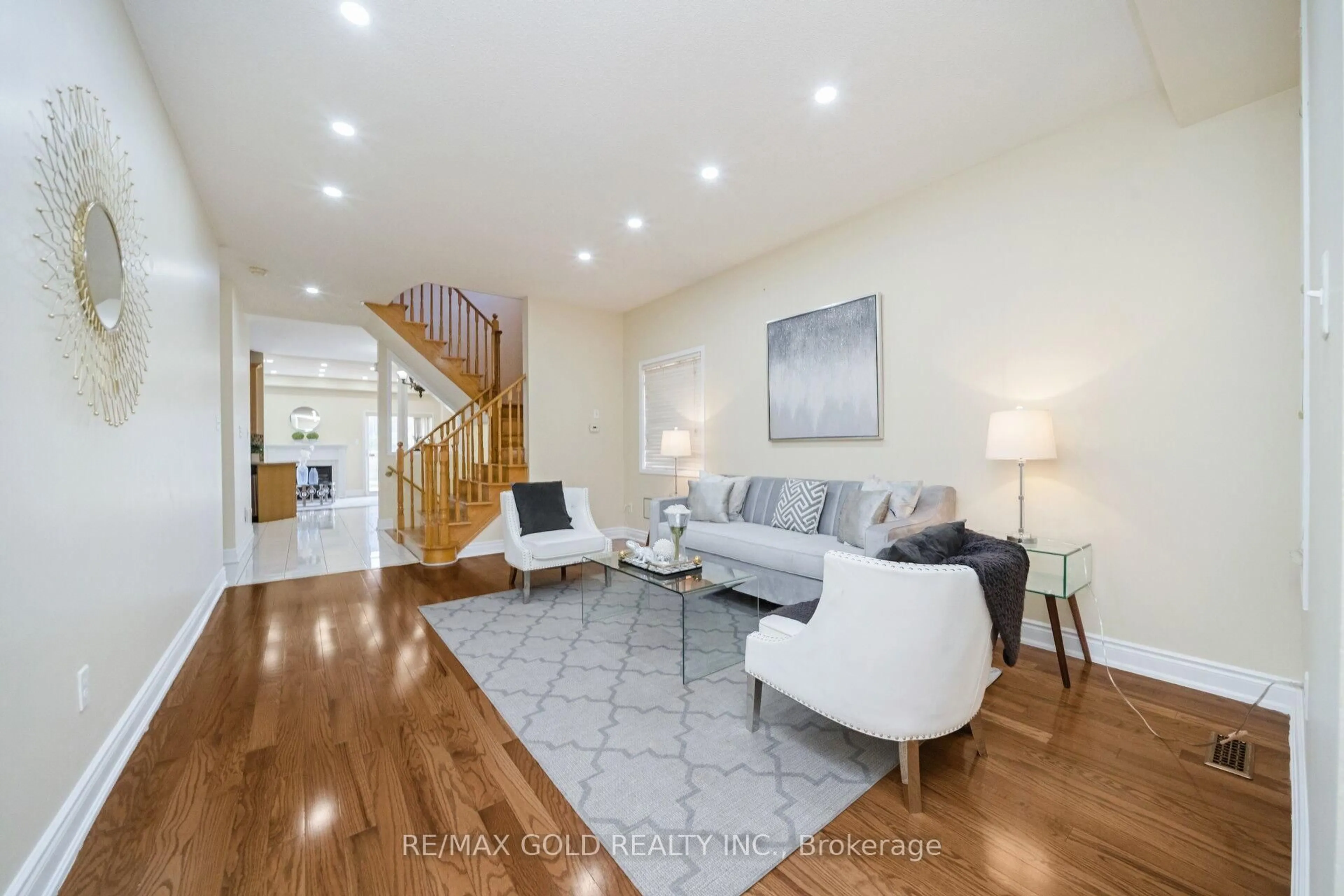 Living room with furniture, wood/laminate floor for 30 Grover Rd, Brampton Ontario L6Y 5R4