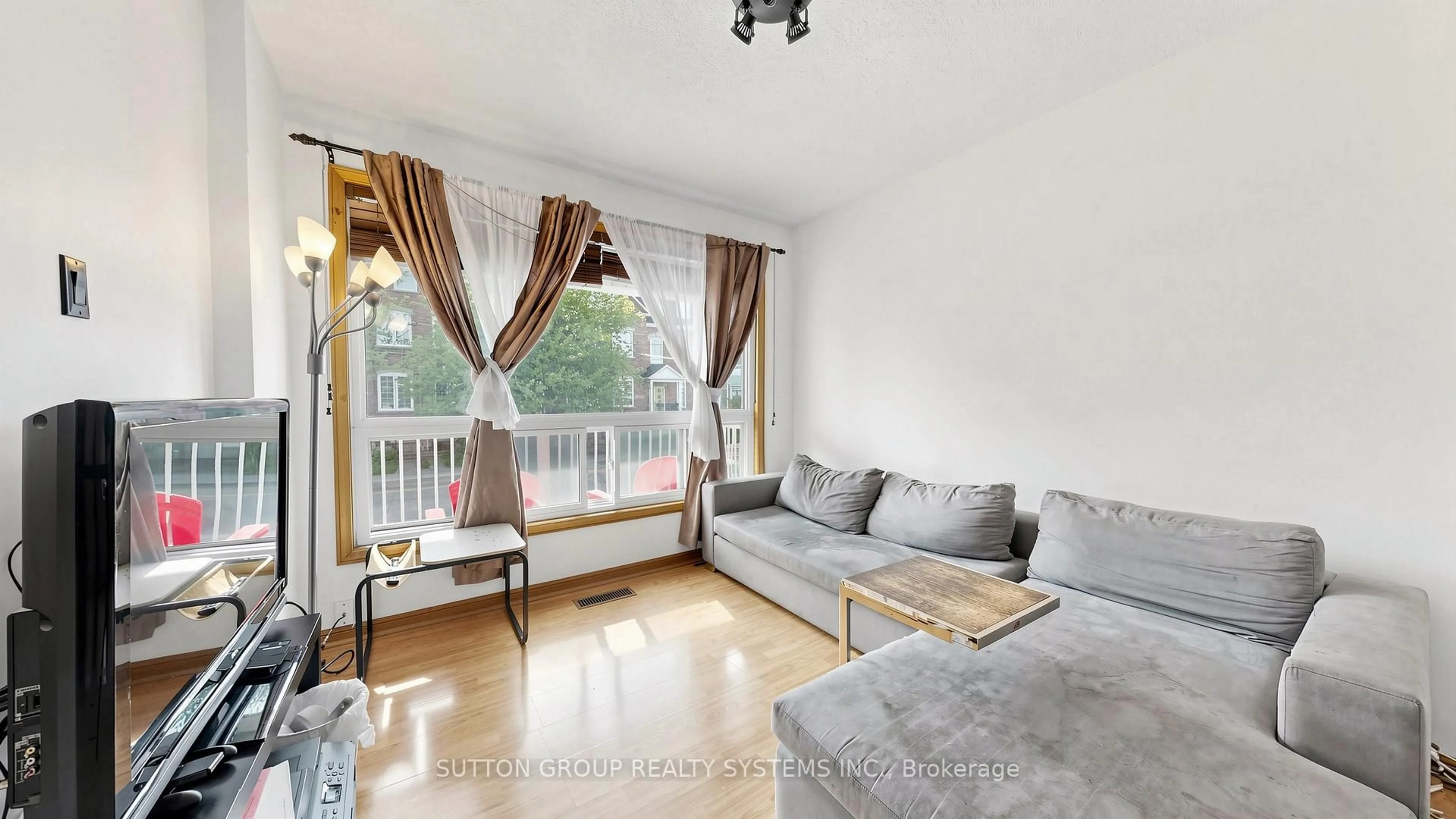 Living room with furniture, wood/laminate floor for 289D Bartlett Ave, Toronto Ontario M6H 3G3