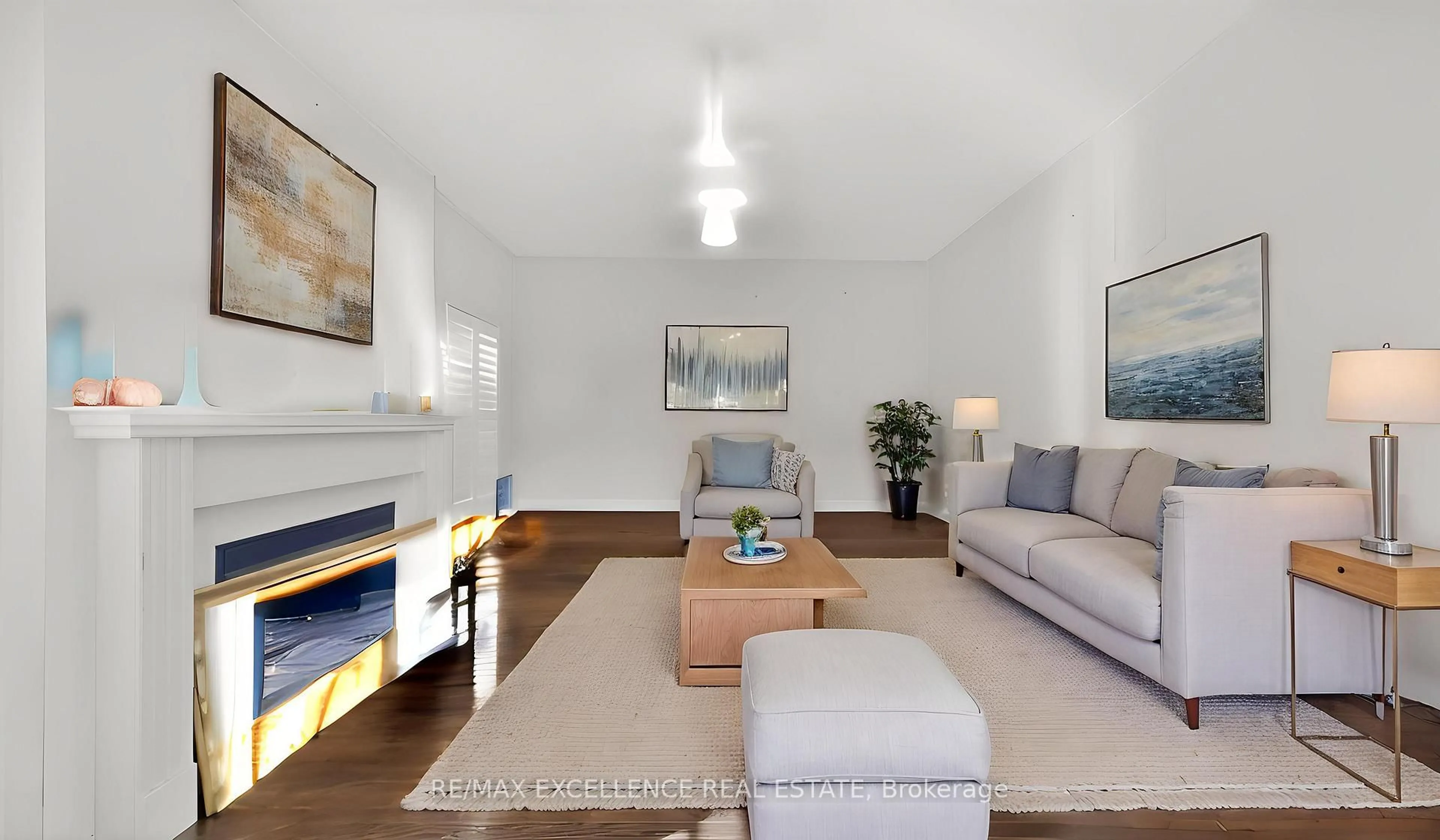 Living room with furniture, wood/laminate floor for 13 Lillian Cres, Brampton Ontario L6R 3P9