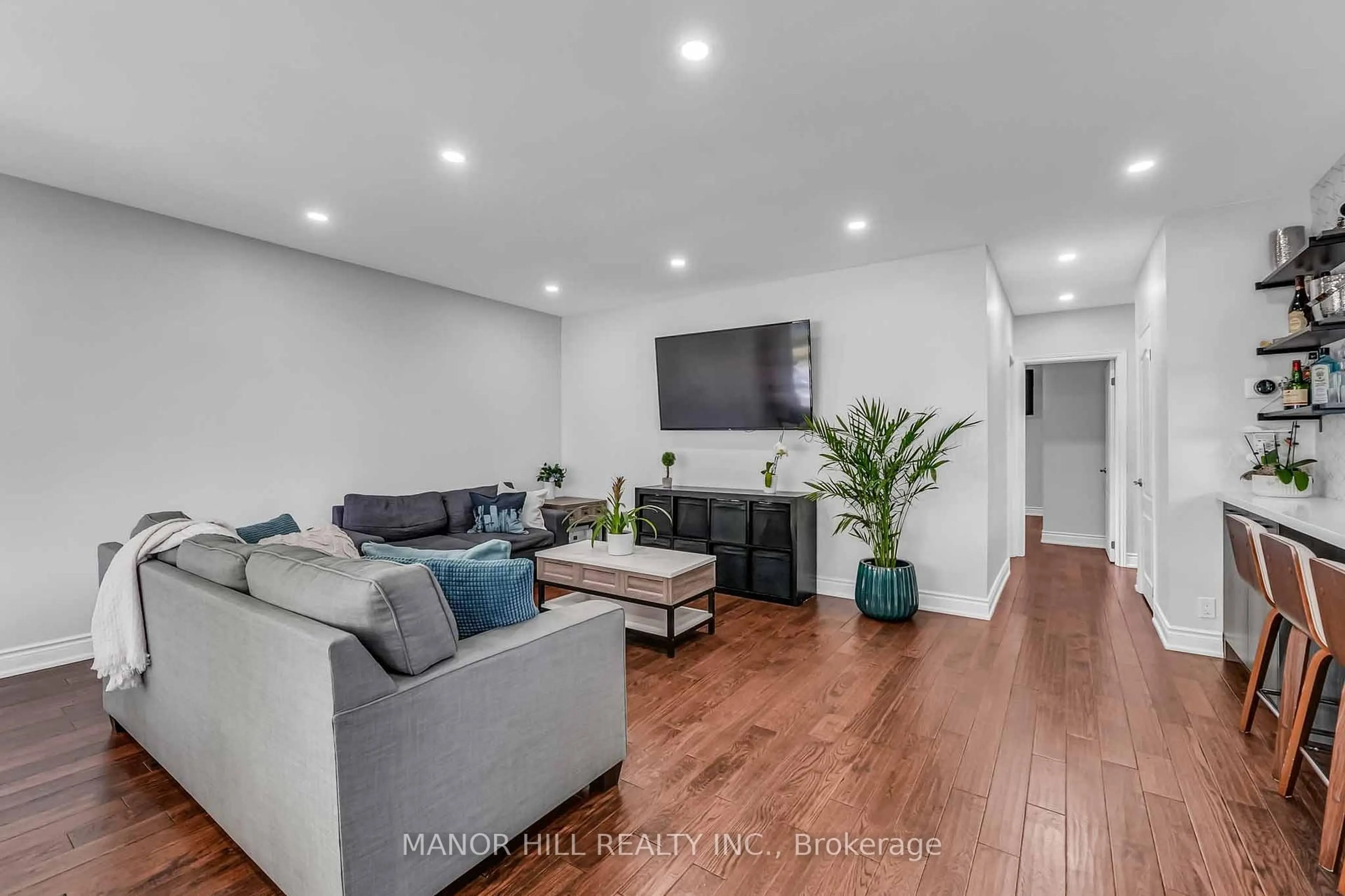 Living room with furniture, wood/laminate floor for 338 The Westway, Toronto Ontario M9R 1H2