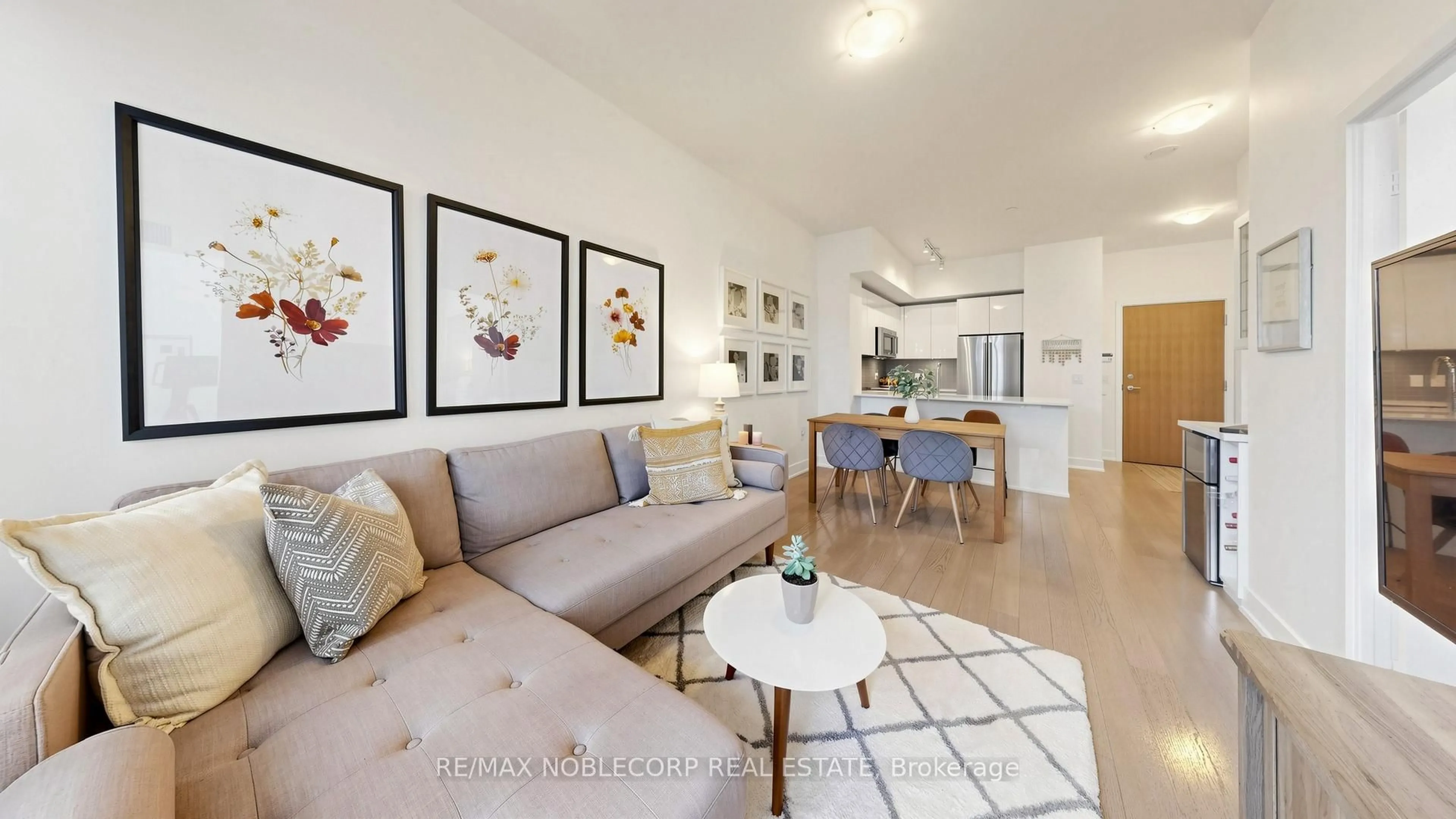 Living room with furniture, wood/laminate floor for 20 Shore Breeze Dr #505, Toronto Ontario M8V 0C7