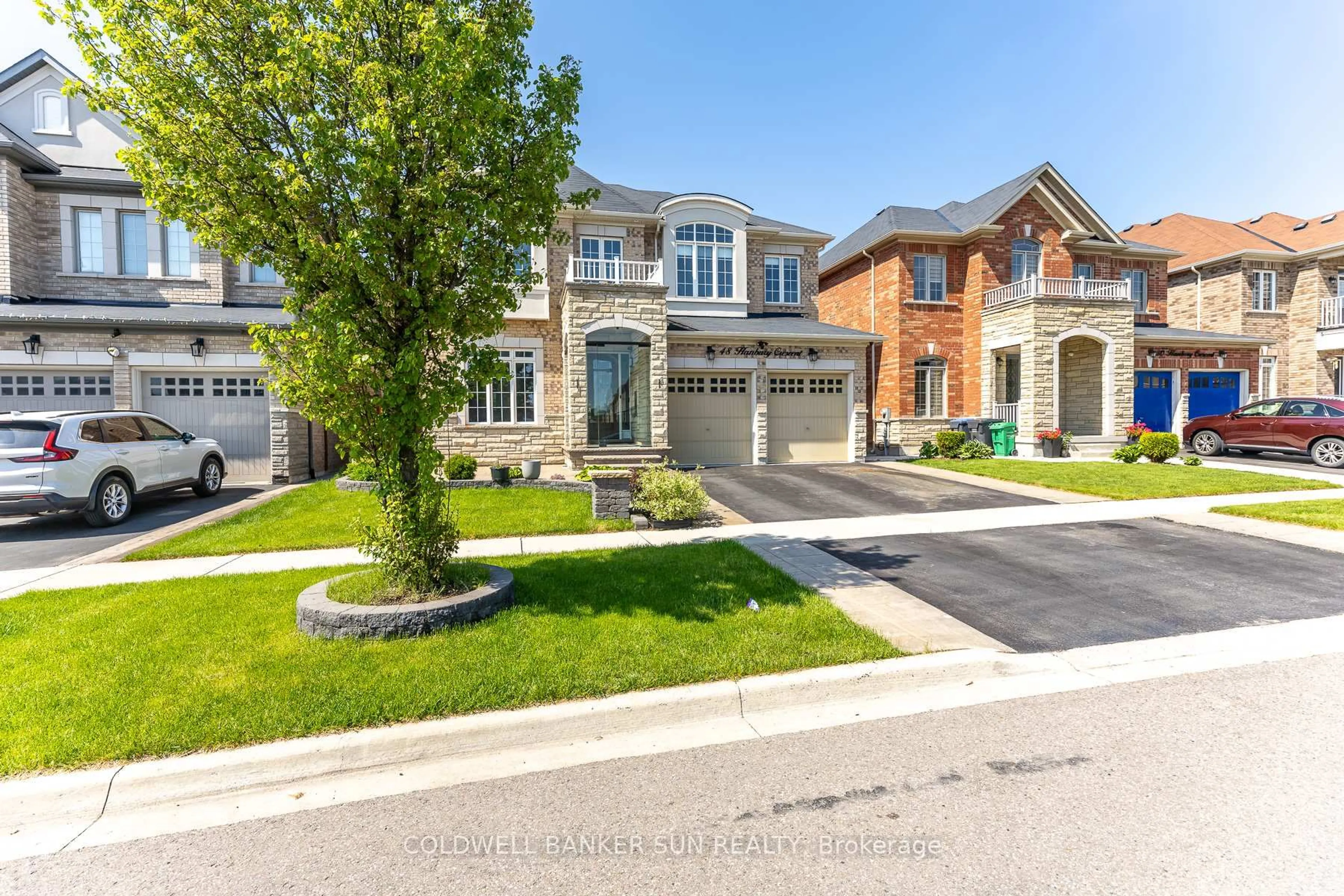 Home with brick exterior material, street for 48 Hanbury Cres, Brampton Ontario L6X 5N7