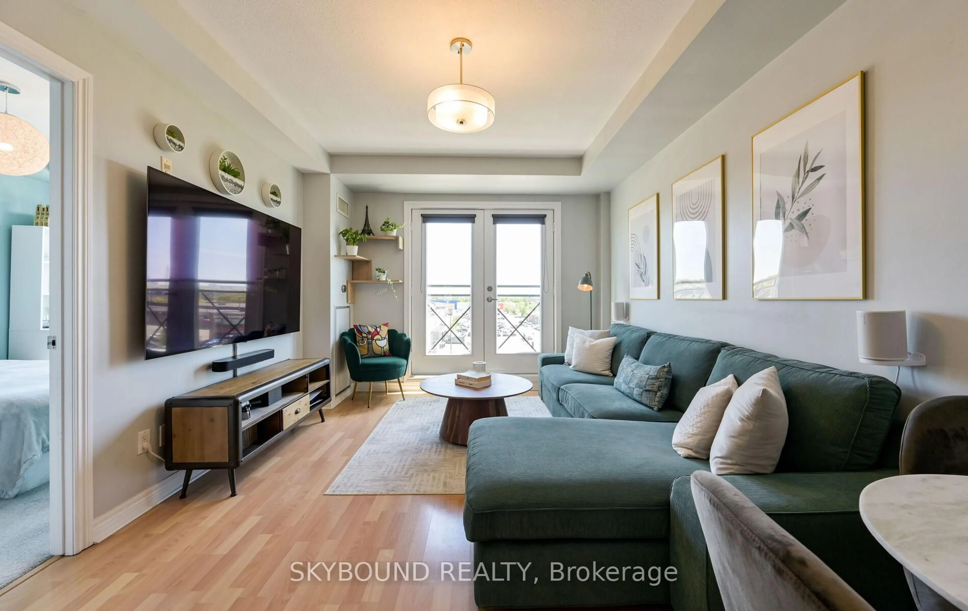 Living room with furniture, wood/laminate floor for 1415 Lawrence Ave #516, Toronto Ontario M6L 1A9