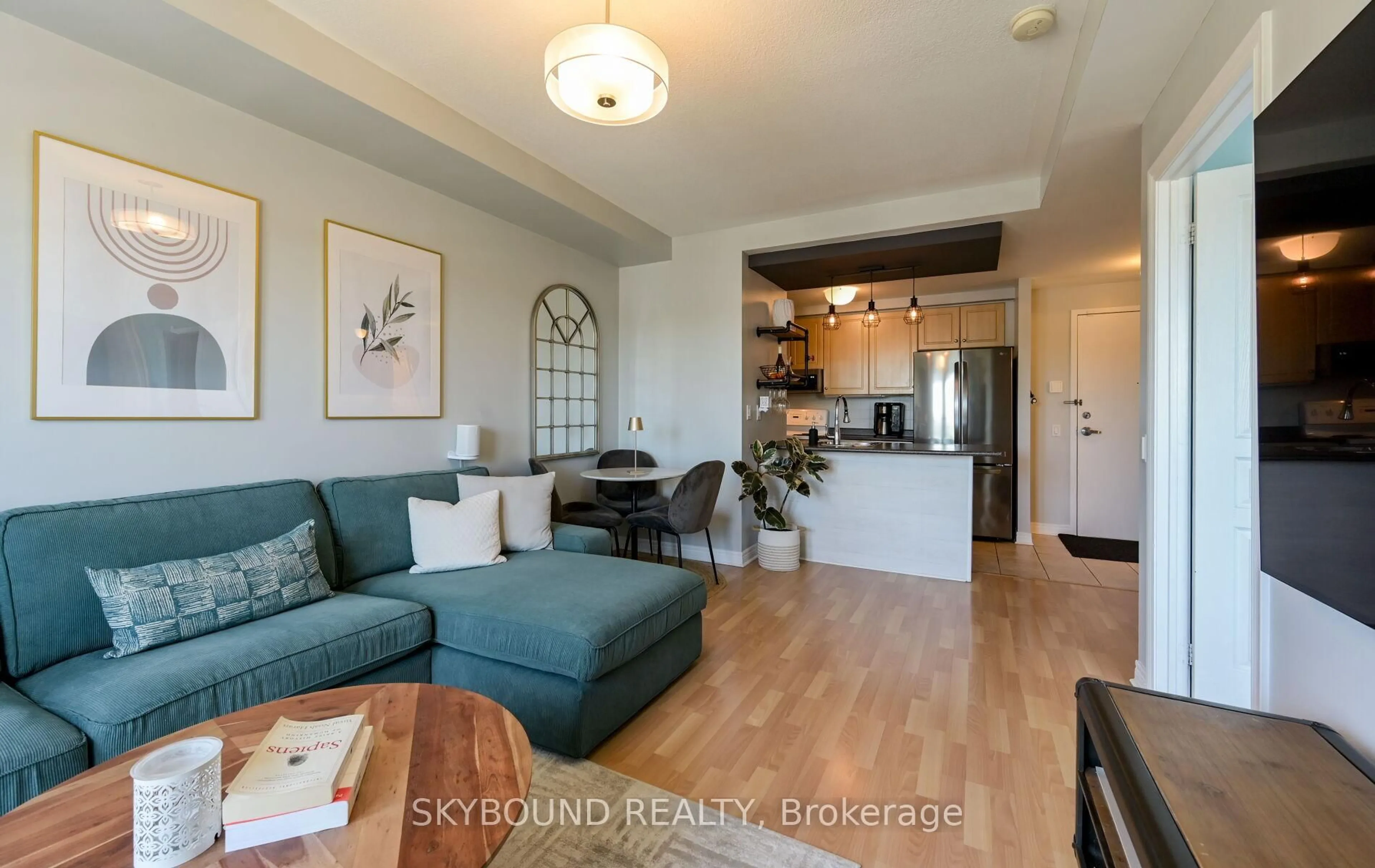 Living room with furniture, wood/laminate floor for 1415 Lawrence Ave #516, Toronto Ontario M6L 1A9