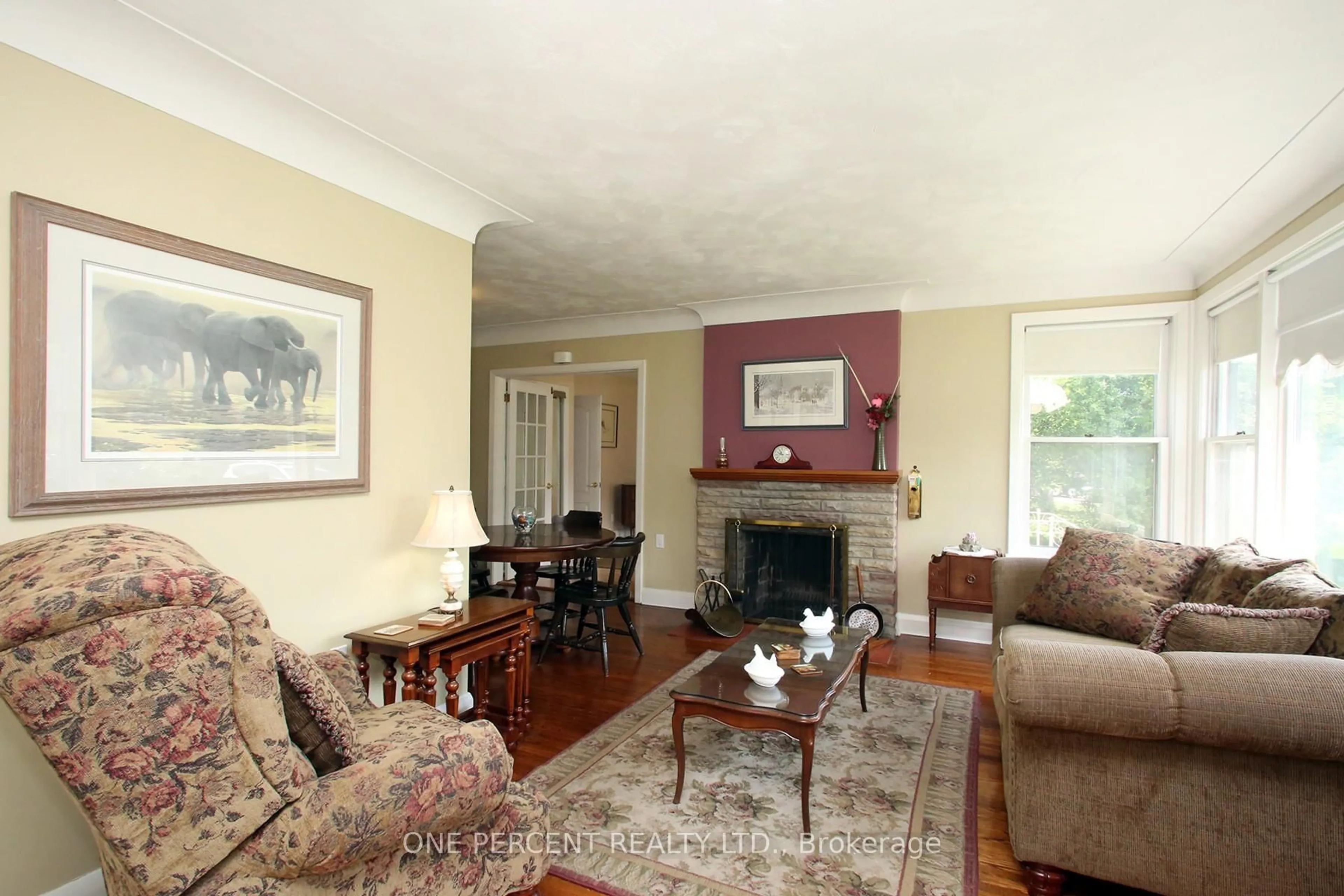 Living room with furniture, wood/laminate floor for 2455 Rebecca St, Oakville Ontario L6L 2B1