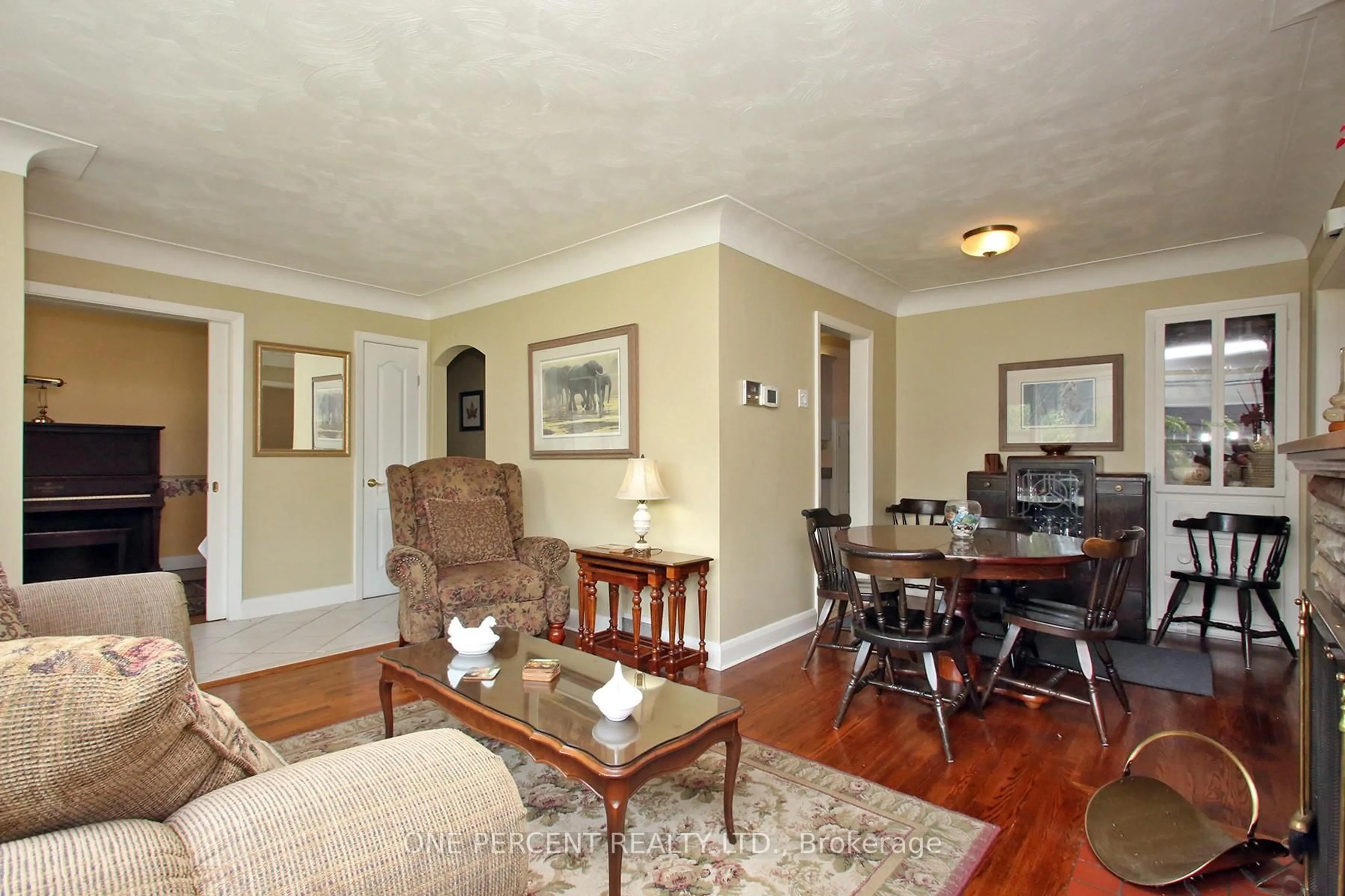 Living room with furniture, wood/laminate floor for 2455 Rebecca St, Oakville Ontario L6L 2B1