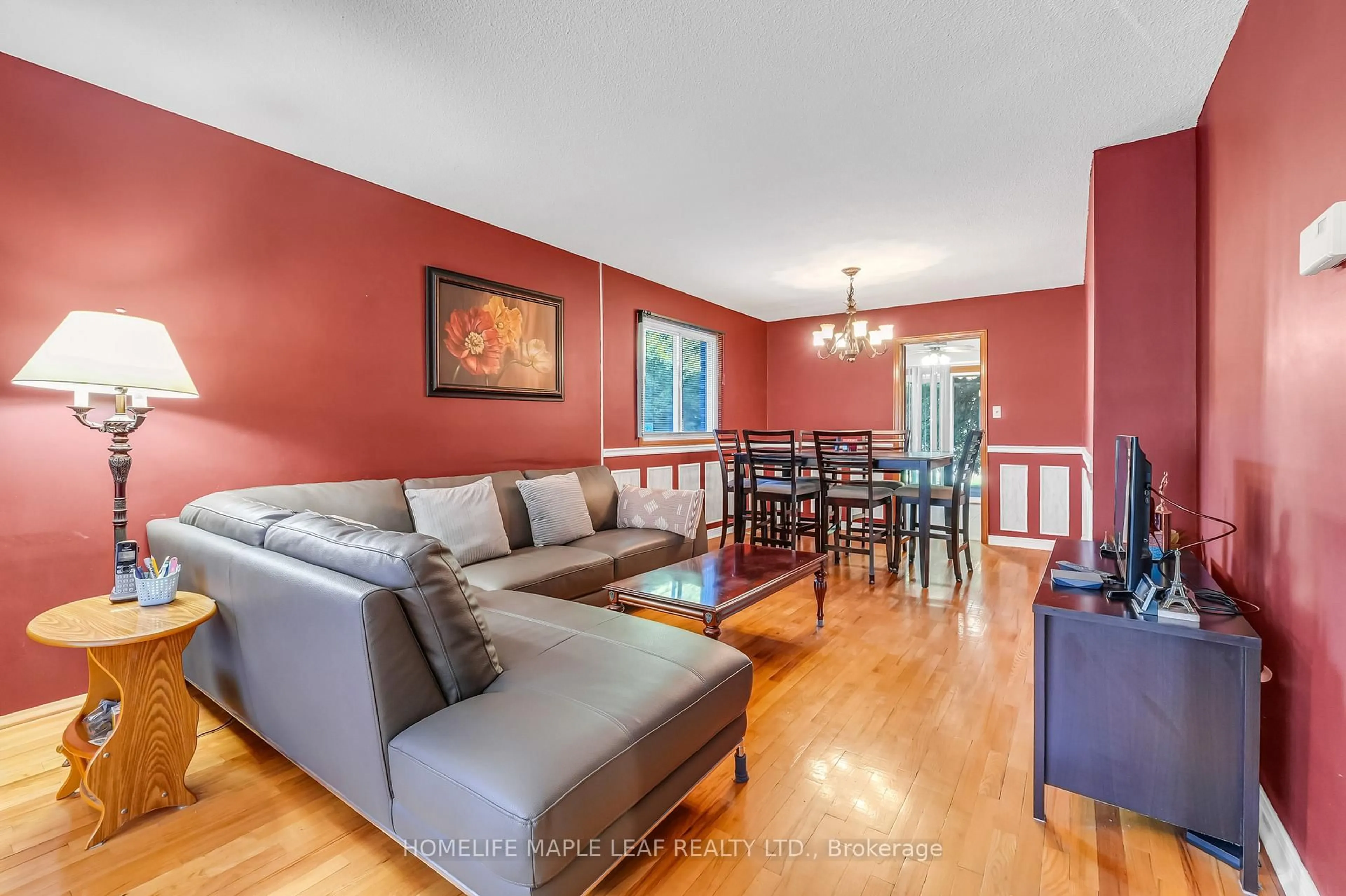 Living room with furniture, wood/laminate floor for 14 Manitou Cres, Brampton Ontario L6S 2Z8