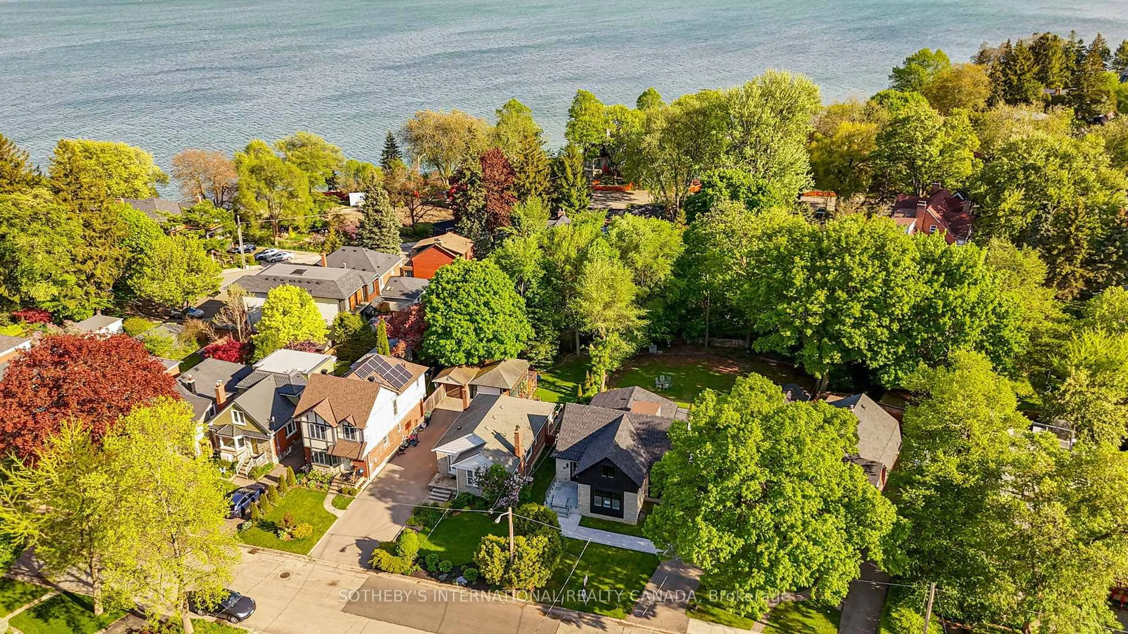 A pic from outside/outdoor area/front of a property/back of a property/a pic from drone, water/lake/river/ocean view for 33 Miles Rd, Toronto Ontario M8V 1V4