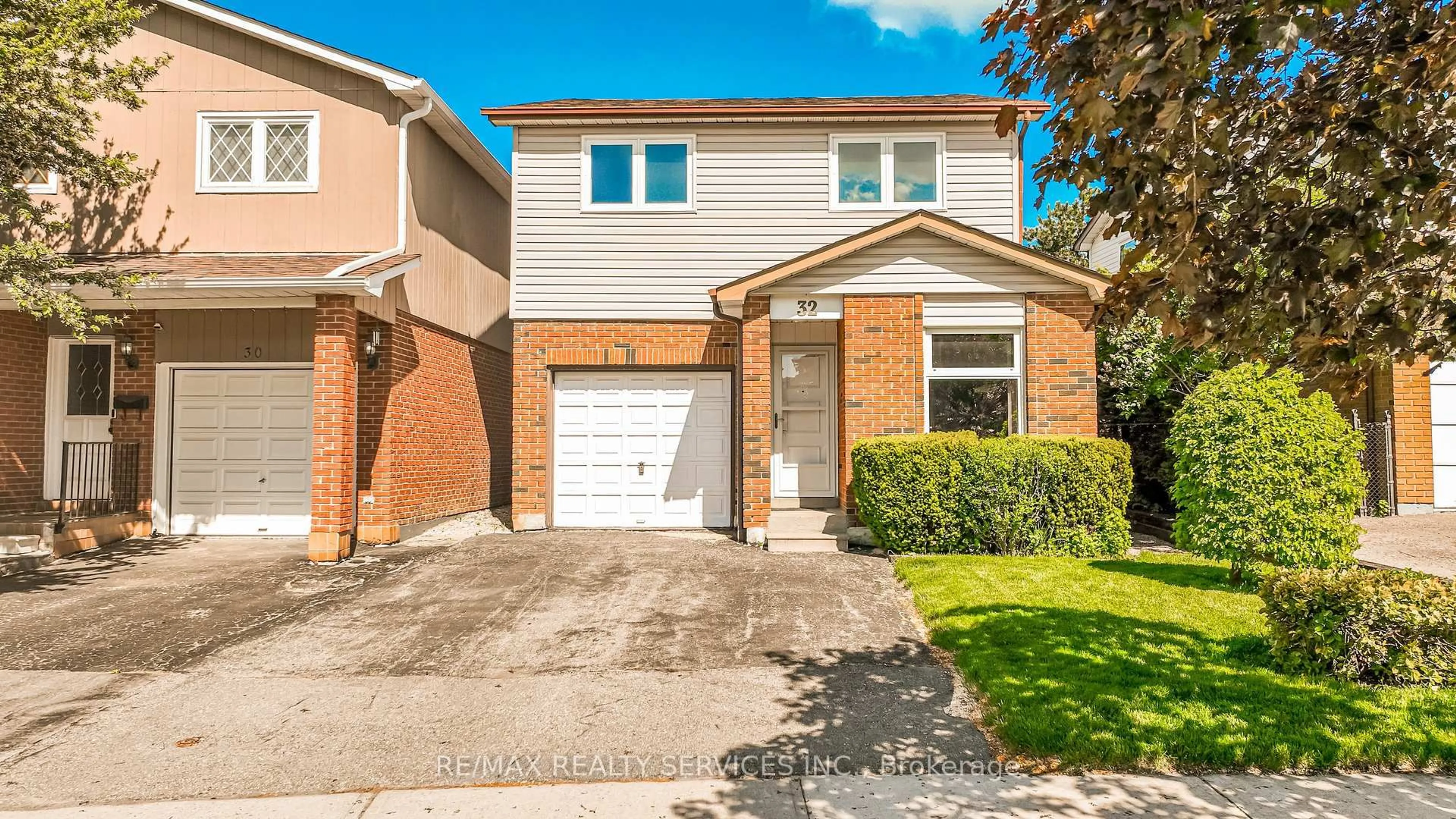 Home with brick exterior material, street for 32 Winterfold Dr, Brampton Ontario L6V 3T2