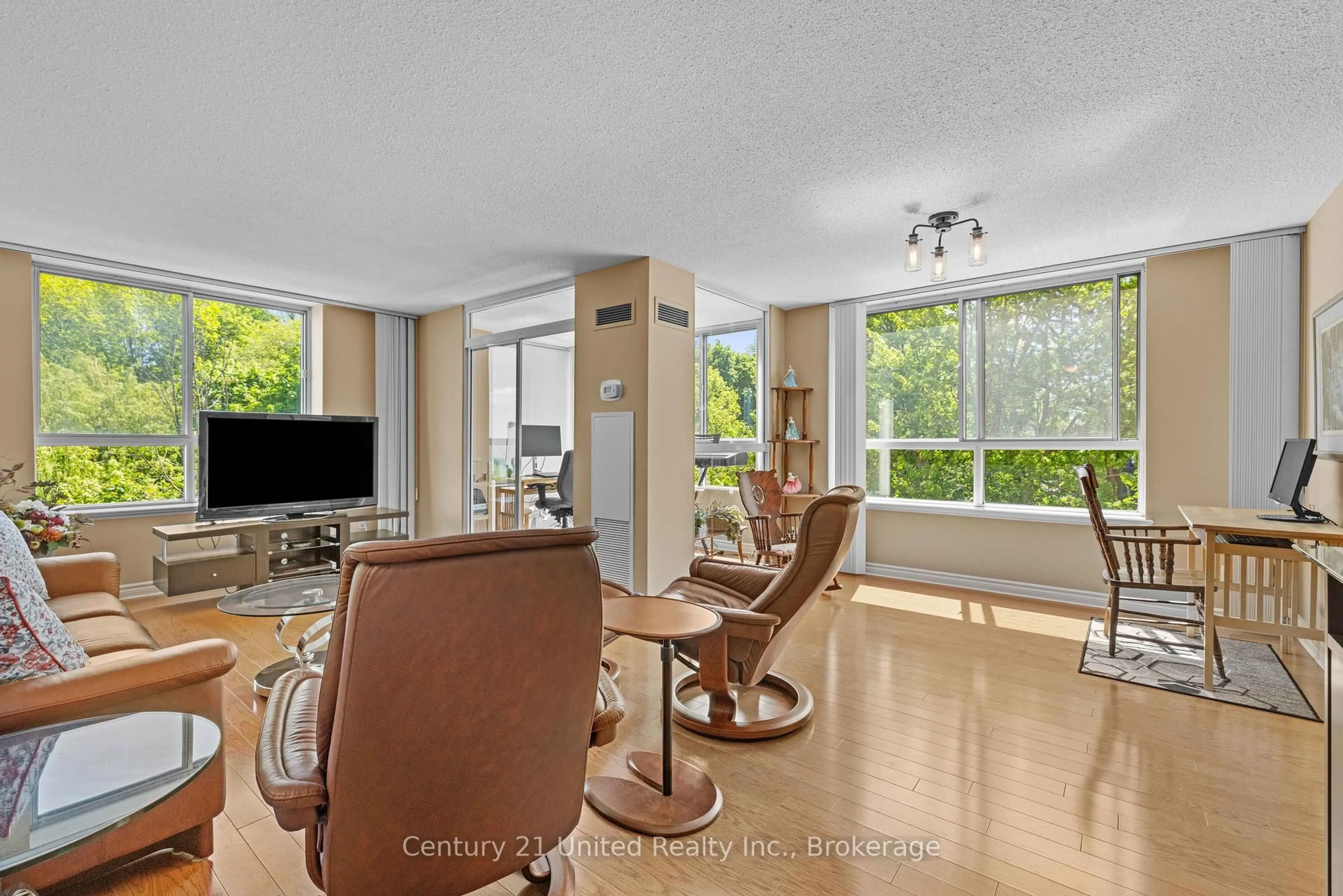 Living room with furniture, unknown for 1485 Lakeshore Rd #505, Mississauga Ontario L5E 3G2