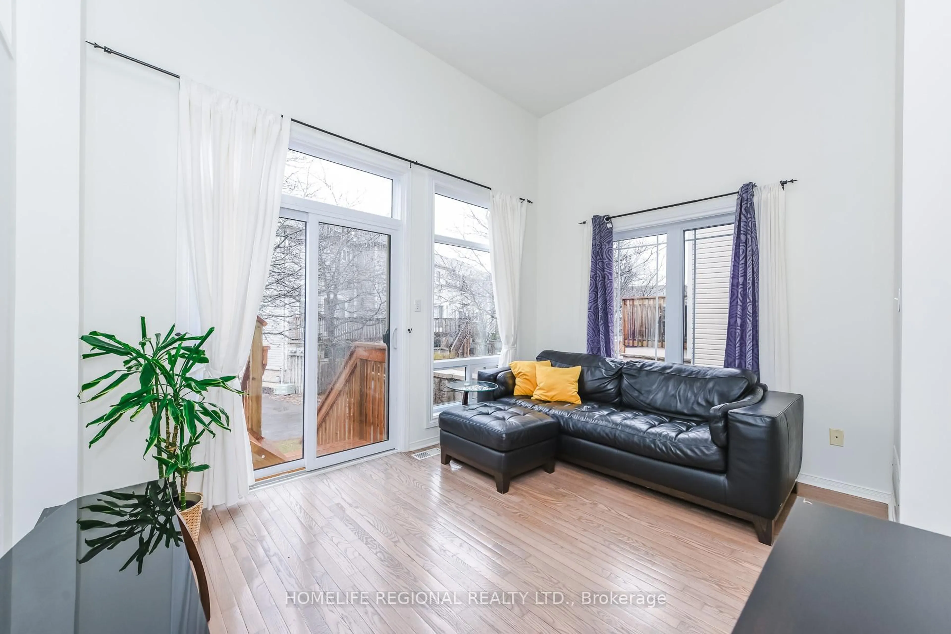 Living room with furniture, wood/laminate floor for 7105 Branigan Gate #72, Mississauga Ontario L5N 7S2