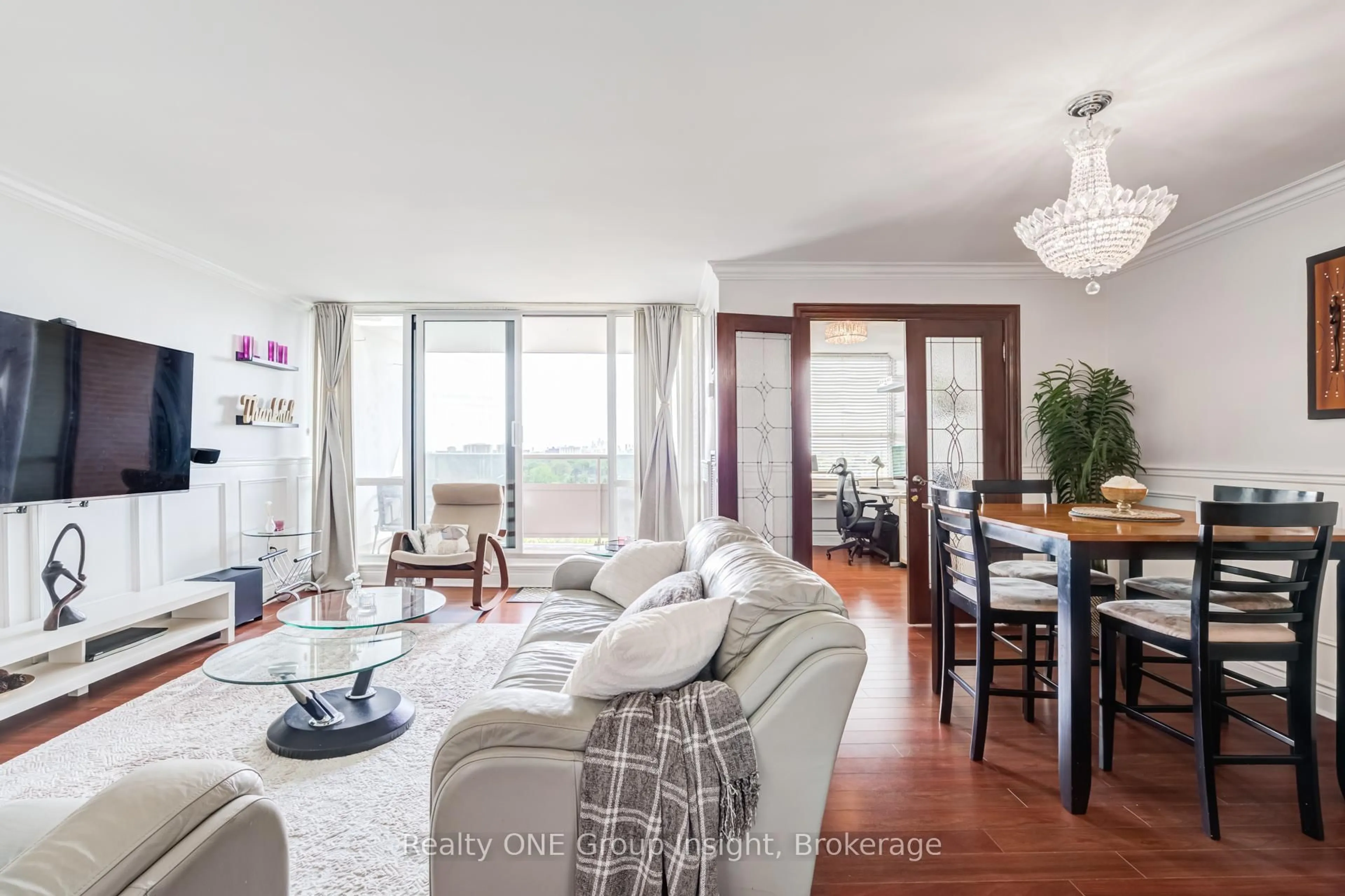 Living room with furniture, wood/laminate floor for 625 The West Mall #1105, Toronto Ontario M9C 4W9